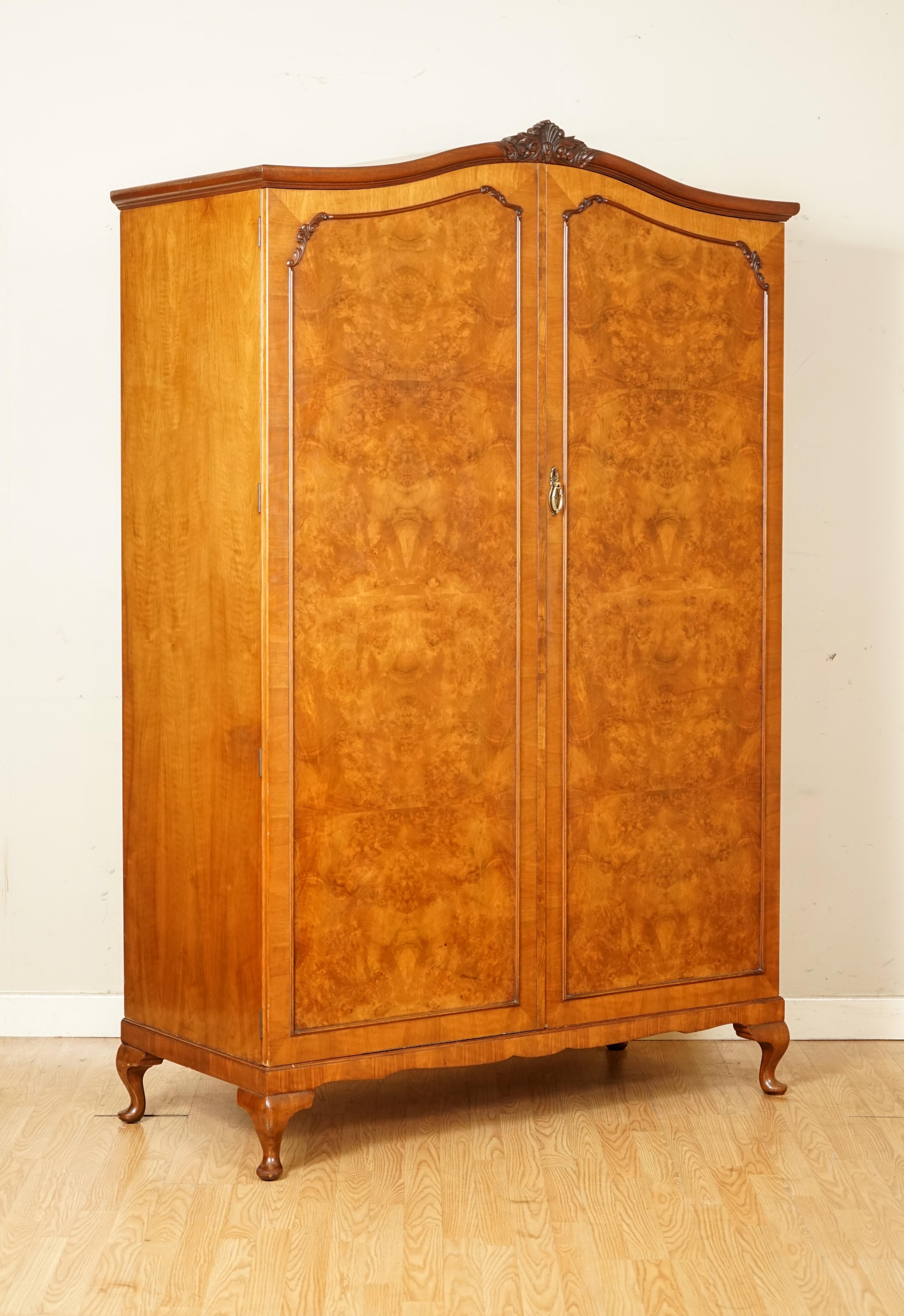 We are so excited to present to you this Beautiful Alfred Cox London Burr Walnut Double Wardrobe.

Here we have a good quality Antique English carved burr walnut wardrobe. Circa 1930's made by the British iconic designer and cabinetmaker, Alfred