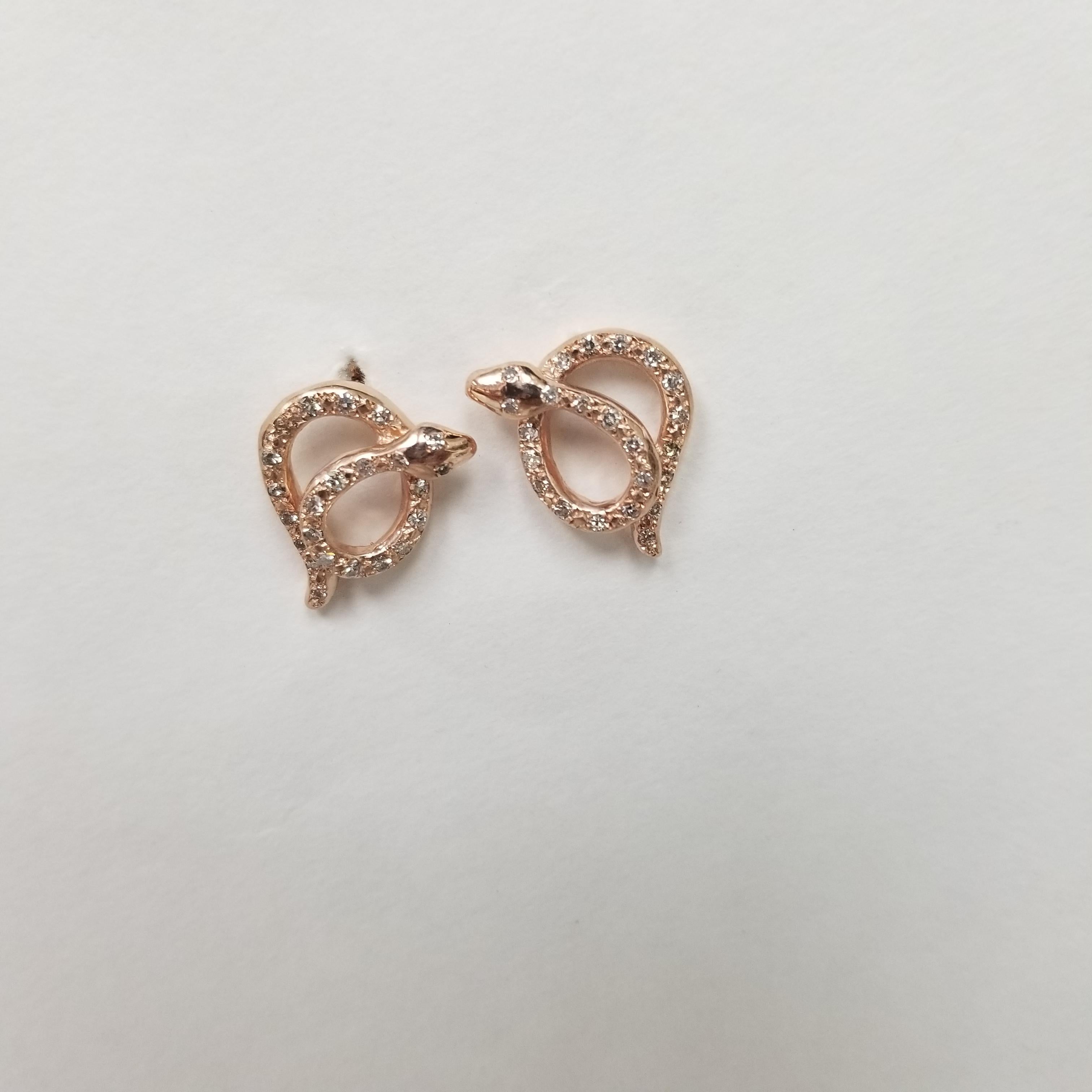 Beautiful and amazing craftsmanship on this 14k rose gold diamond snake earrings.  With a left and right style.
Specifications:
    main stone: 46 single cut diamonds
    carat total weight:  .65pts.
    color:G
    clarity:VS
    metal:14K ROSE