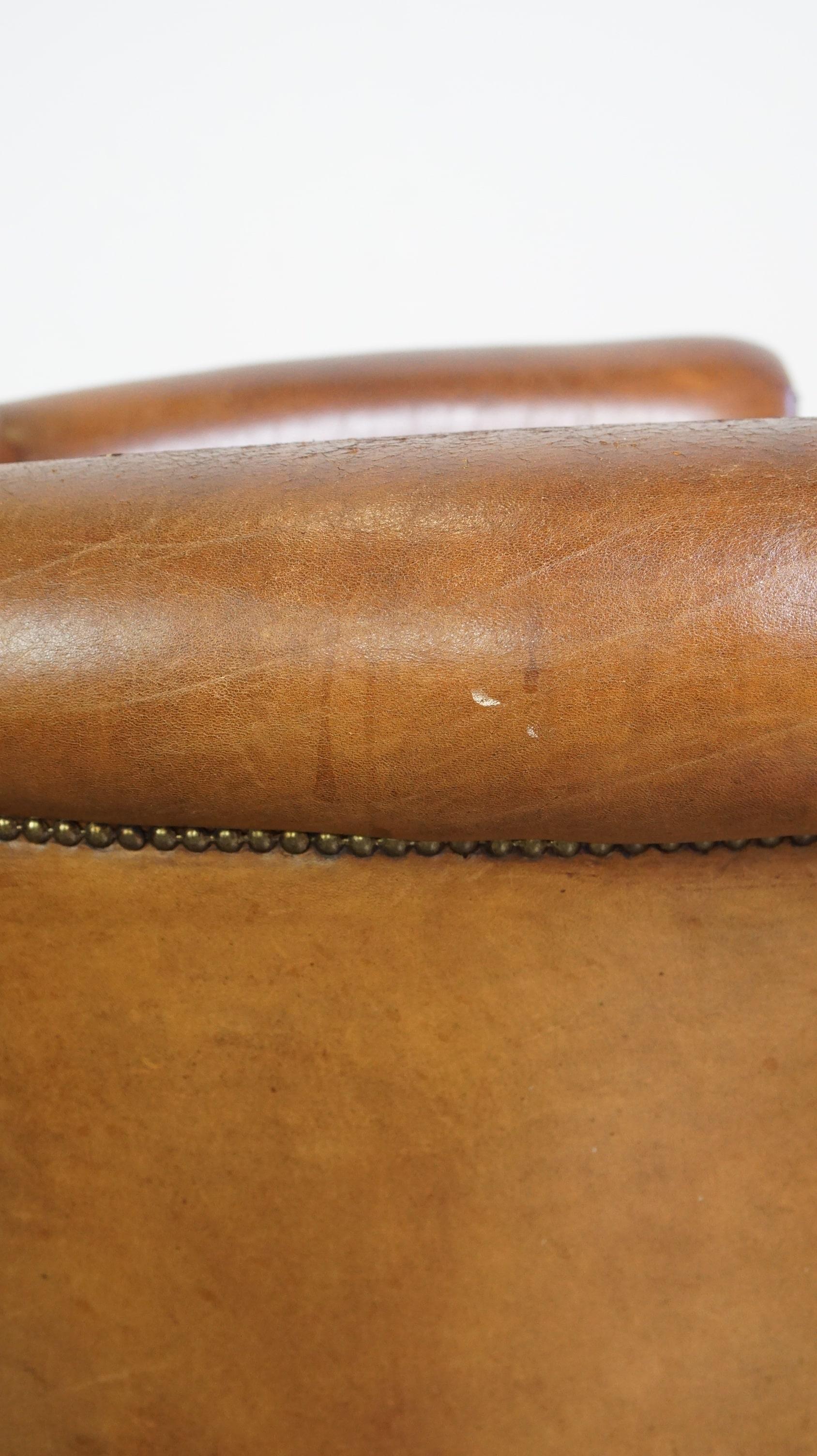 Beautiful and comfortable sheepskin armchair, finished with decorative nailheads For Sale 4