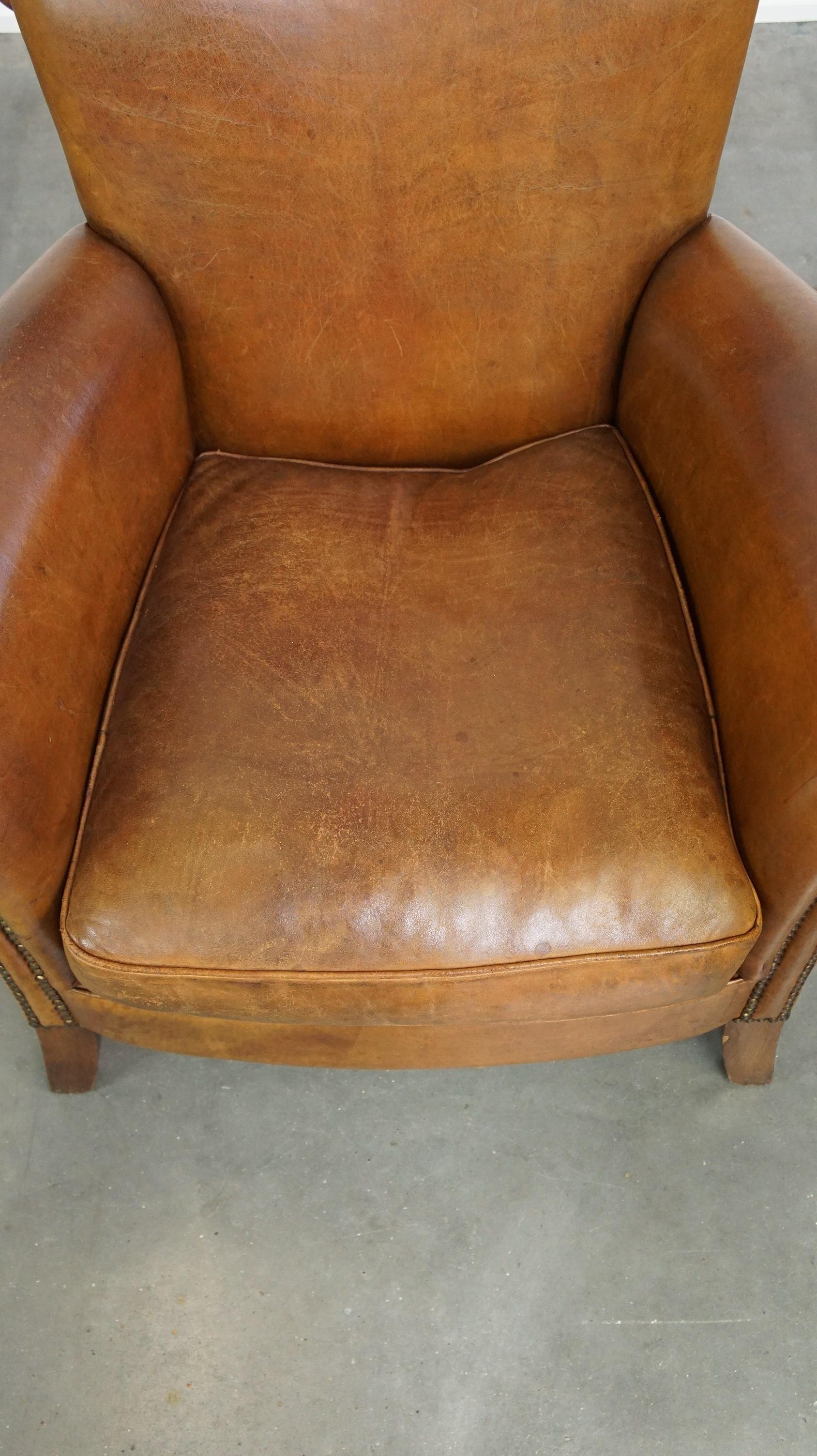Sheepskin Beautiful and comfortable sheepskin armchair, finished with decorative nailheads For Sale