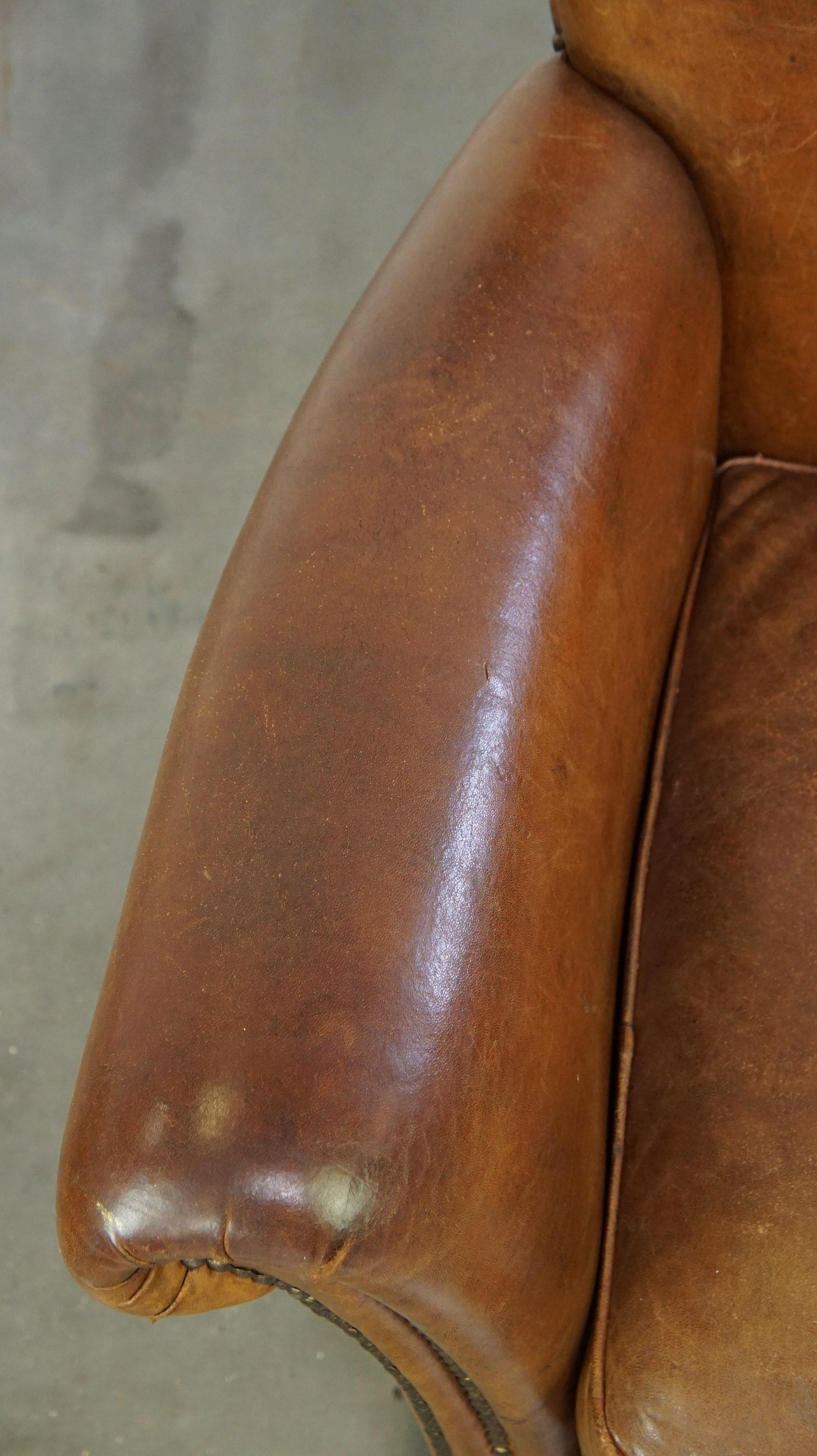 Beautiful and comfortable sheepskin armchair, finished with decorative nailheads For Sale 1