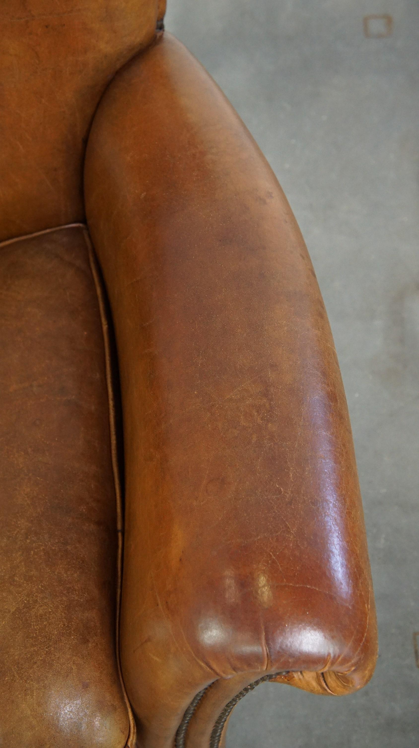 Beautiful and comfortable sheepskin armchair, finished with decorative nailheads For Sale 2