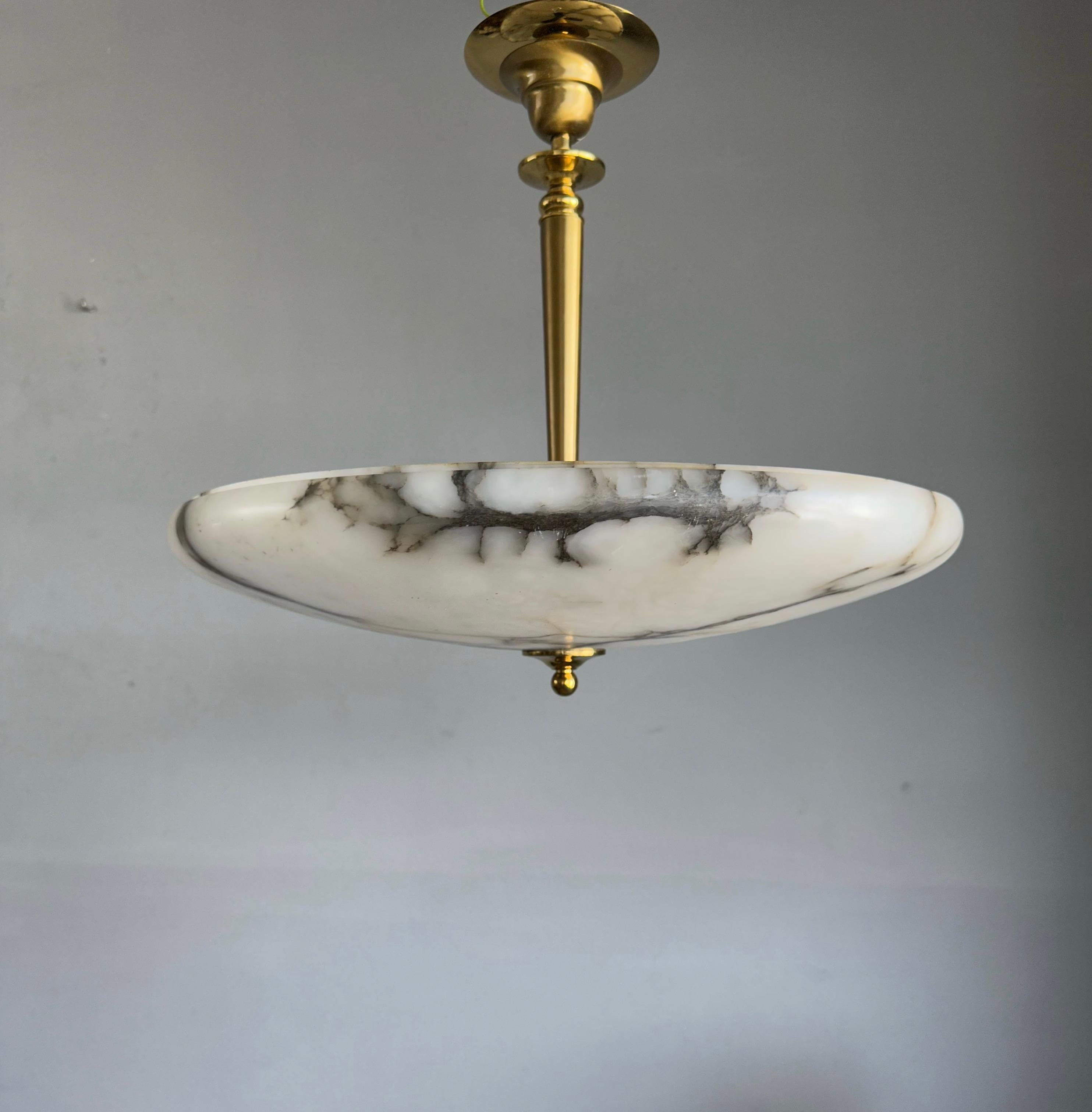 Great shape antique, three-light Art Deco ceiling lamp.

This wonderfully designed and truly beautiful light fixture has been very well looked after by its former owners. In diameter too, this is one of the largest antique alabaster flush mounts