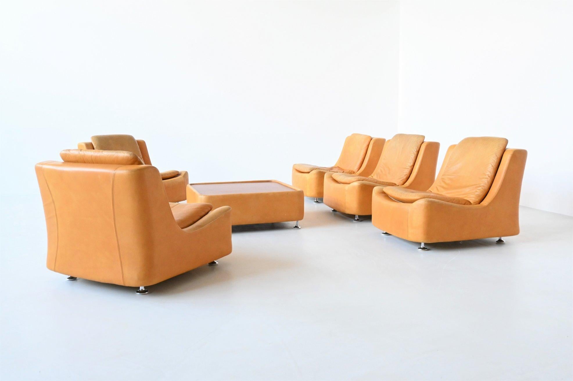 Beautiful and playful sofa set by unknown designer or manufacturer, Germany 1970. This very nice set exists of five seating modules and one coffee table. They are made of molded foam upholstered with nicely stitched and high quality cognac leather