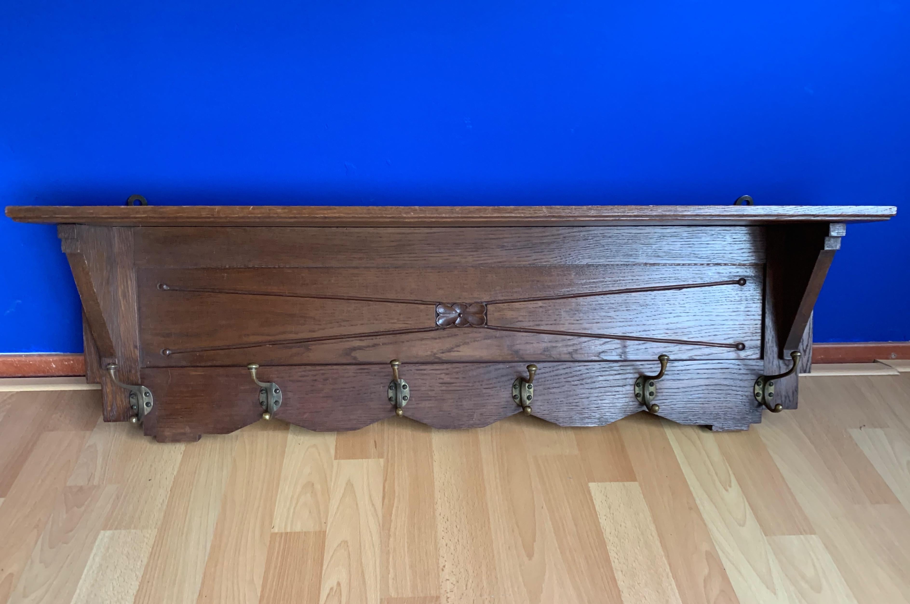 Stunning, geometrical design coat rack.

This all-handcrafted wall coat rack from the earliest years of the 20th century is another great example of the quality of the workmanship in those days. This marvelous Arts & Crafts antique again proves that