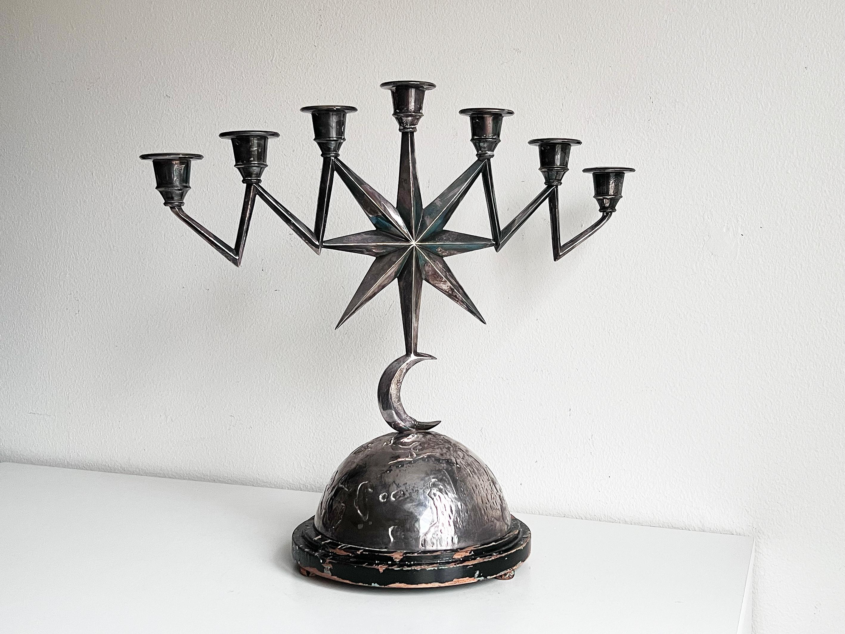 Beautiful and rare 7-armed candelabra, Art Deco 1920-30s, in nickel silver.
Unknown designer. A really decorative object!
Signed on the base: RH-m 1ma N.S
Height: 36 cm.
Width: 37,5 cm
Base diameter: ca 17,8 cm.