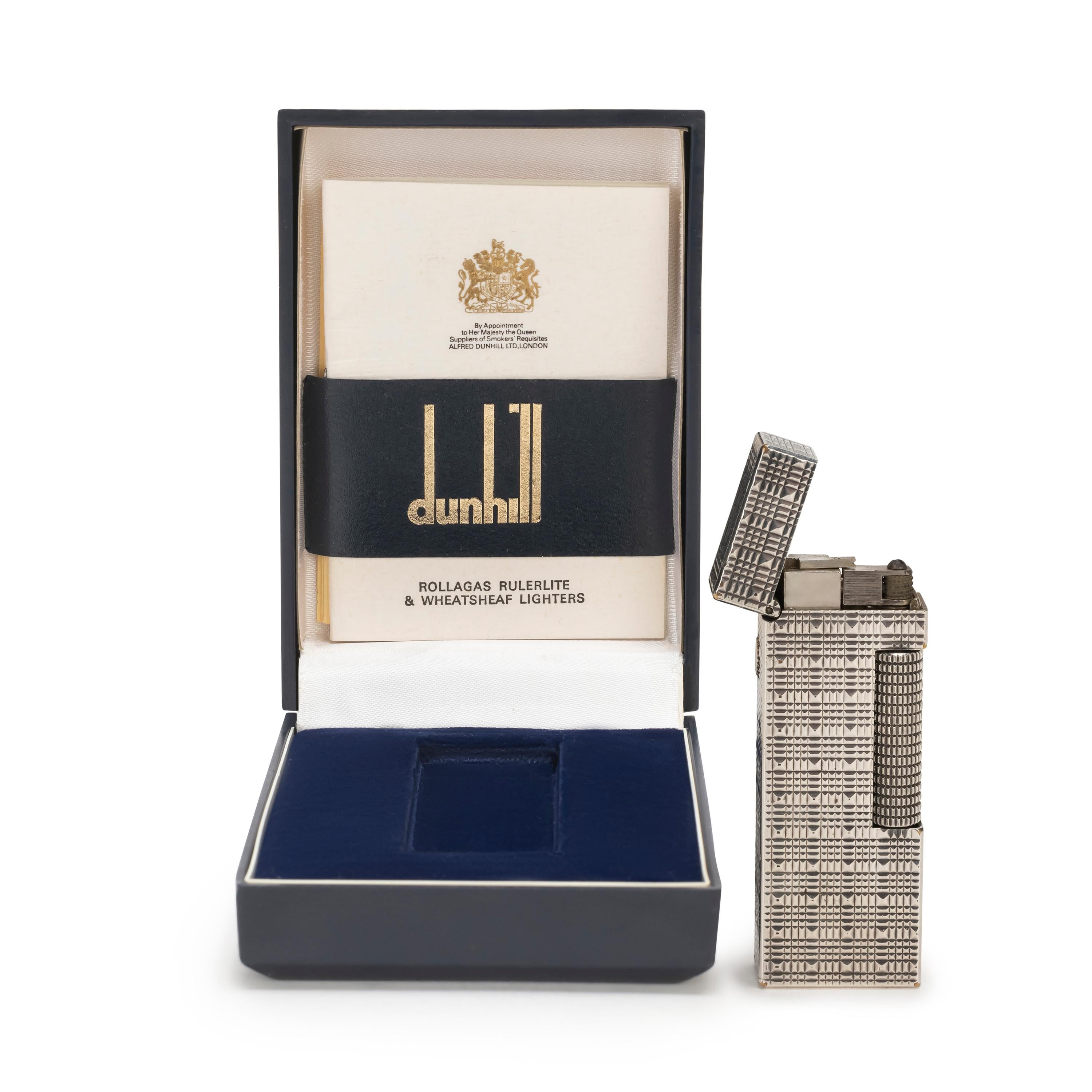 Rare Iconic Vintage and Elegant Dunhill silver Plated Swiss Made Lighter In mint condition.
Works perfectly. 
Iconic and beautifully engineered piece in rare condition.
In original Blue box which is in mint condition, as good as new. 
This lighter