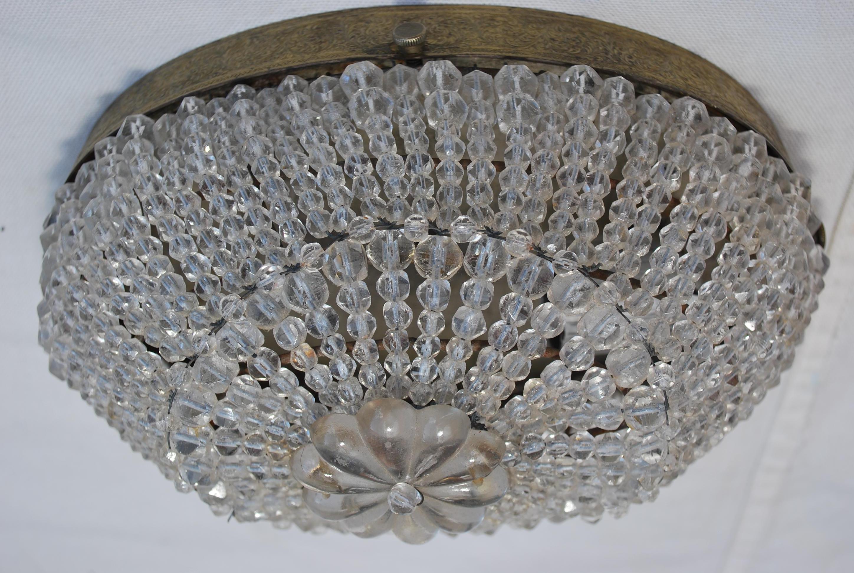 A beautiful and rare 1930's beaded flush mount light, that size is quite rare, the patina is much nicer in person.
