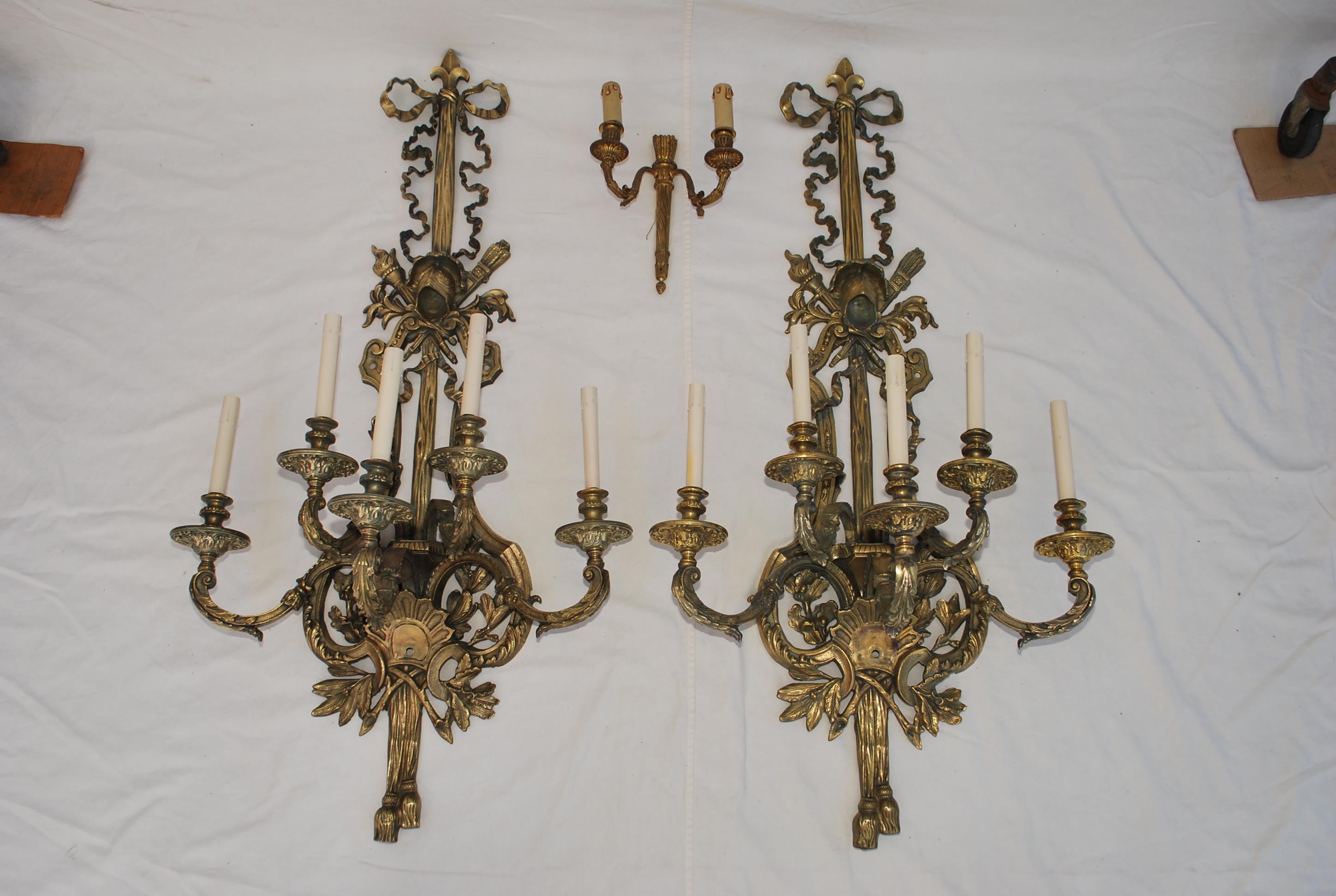 Wow I don't know where to start, I have been selling antique sconces for 28 years, I think this is the second pair like that, that I acquired in 28 years, They are four feet tall and weights 43 pounds each,
They are magnificent, they have been