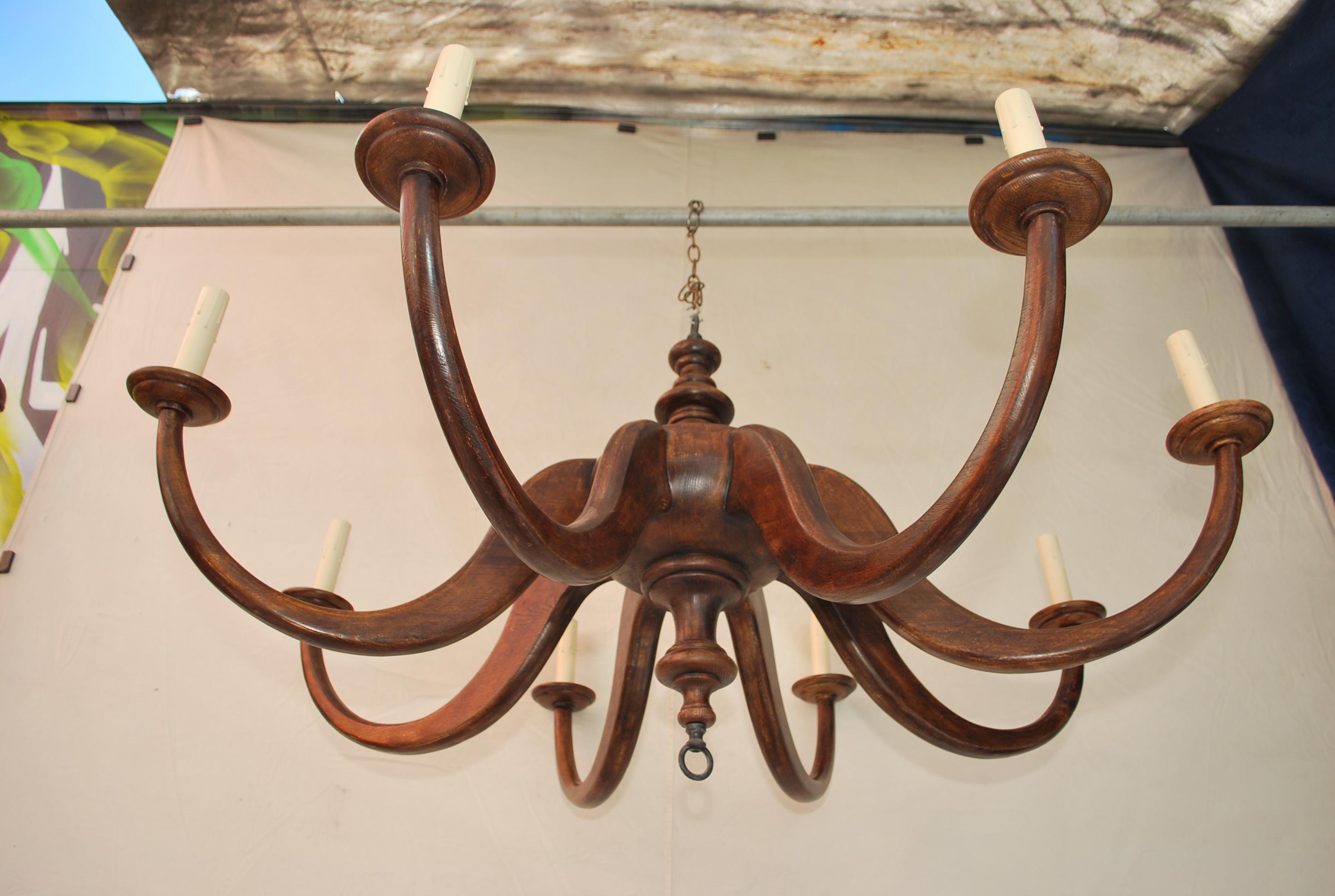 What a beautiful large wood chandelier, I sold it many years ago to a client, it is extremely  rare that  I buy back my merchandise , but this time I made an exception, this is such beautiful  chandelier i could not resist,  