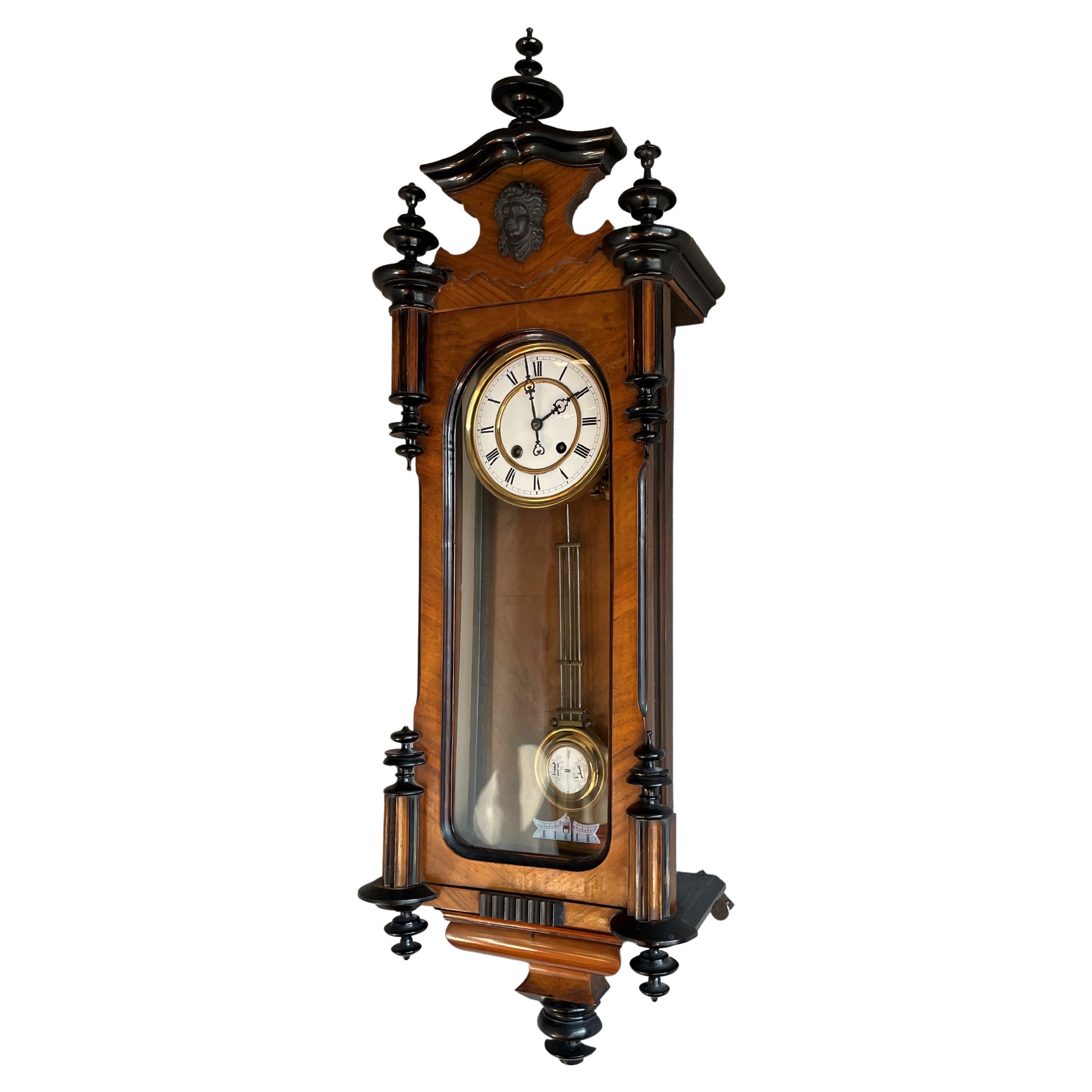 Perfect running and striking, late 1800s, partially ebonized antique wall clock.

If you are looking for a stylish and stately wall clock then this tall antique specimen could be gracing the wall of your home or office space soon. All handcrafted