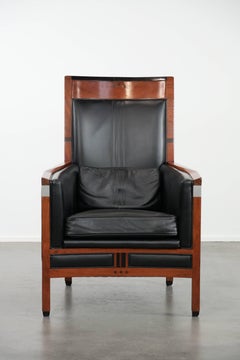 Beautiful and very comfortable black Art Deco design armchair