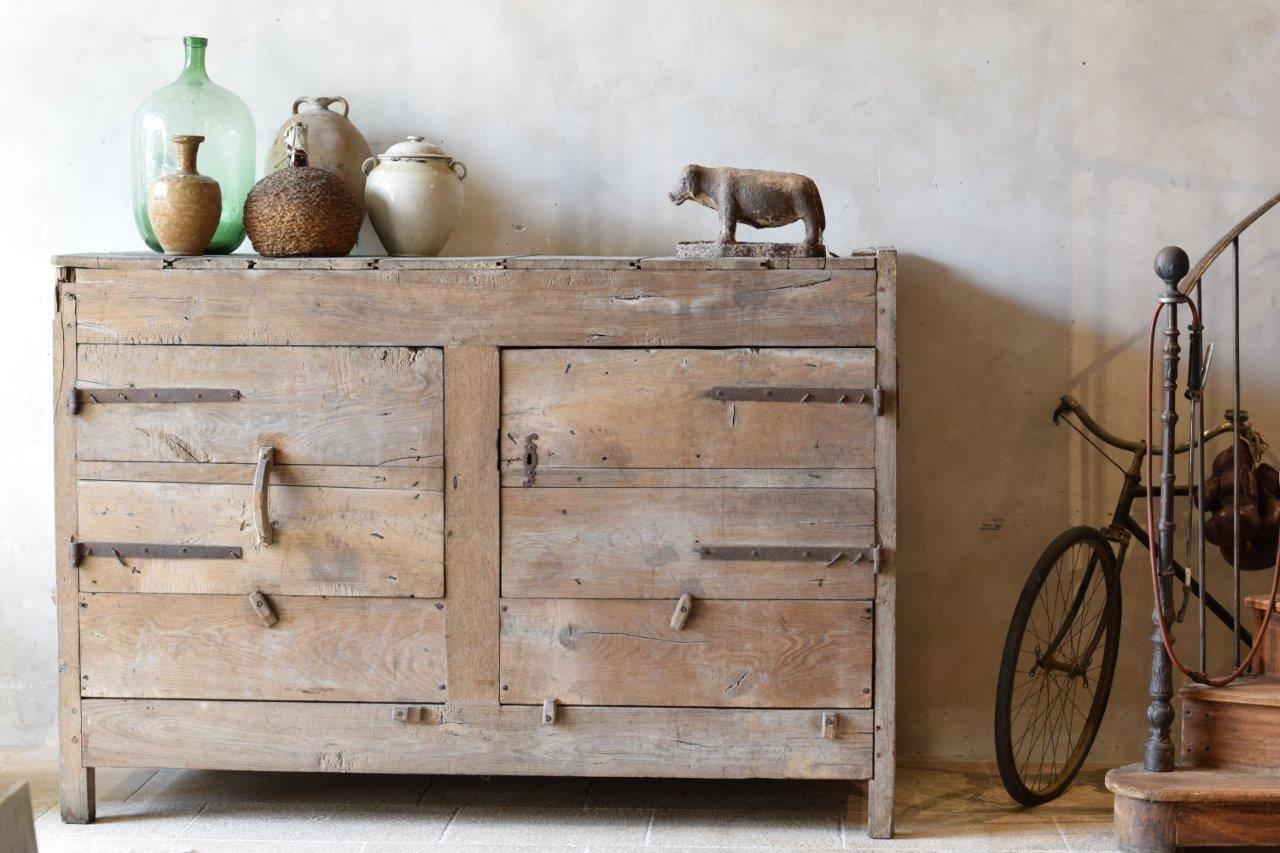 This extremely large wooden cabinet was probably used to store goods at a farm in France. The interior is spacious and could have easily fitted bags with grain or other items. It is very rare that a piece of rural furniture like this survived.