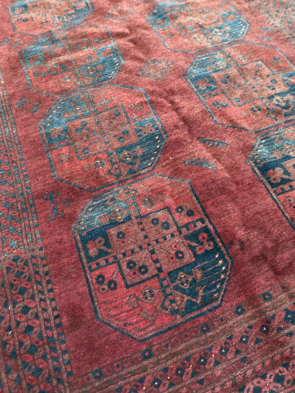 Nice Turkmen Afghan rug with beautiful geometrical design and red, brown and blue colors, entirely hand knotted with wool velvet on wool foundation.