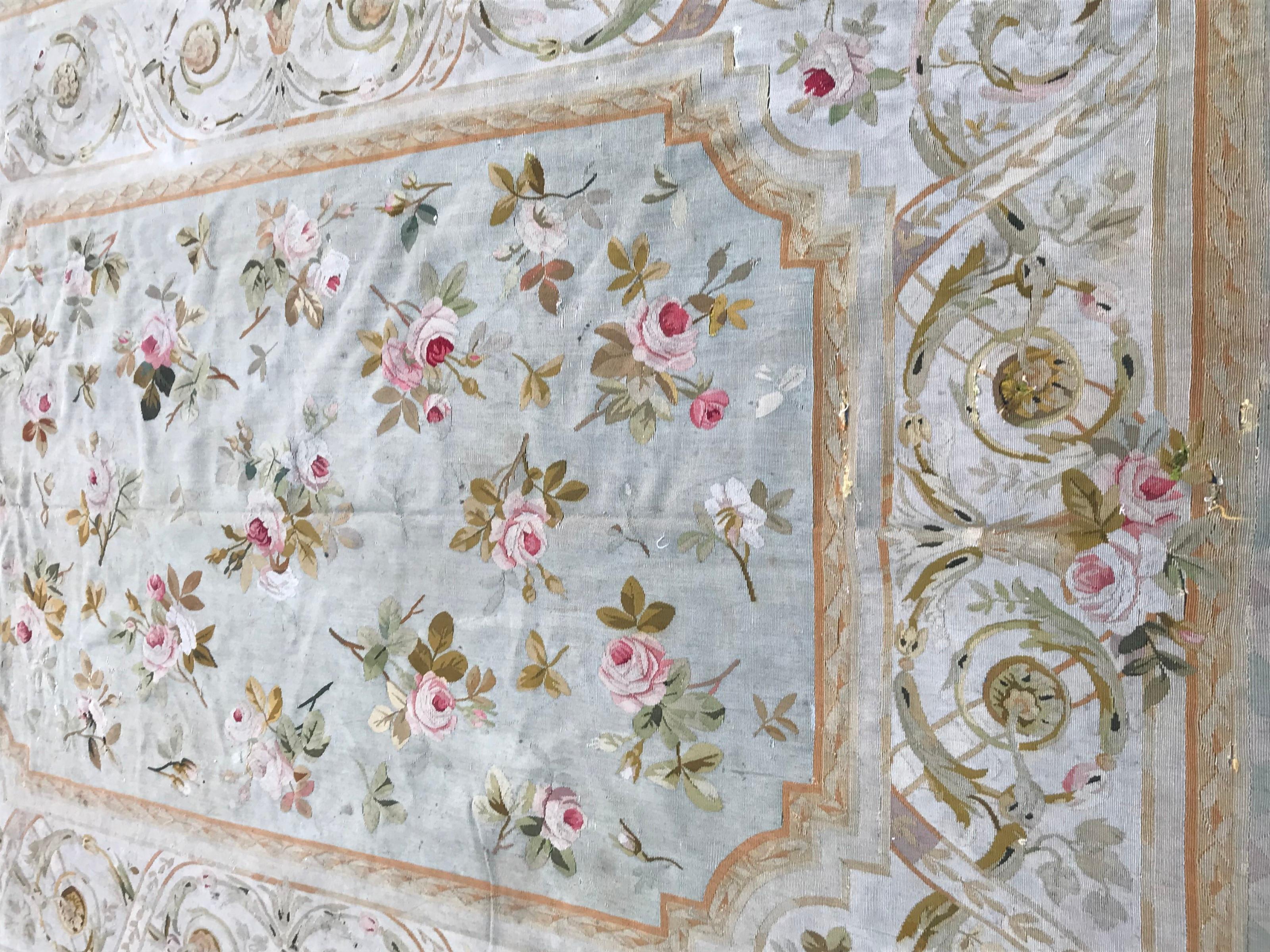 Nice antique Aubusson rug with beautiful light colors with green, and floral Napoleon the third design, entirely handwoven with wool on cotton foundation, damaged at essentially one extremity.
