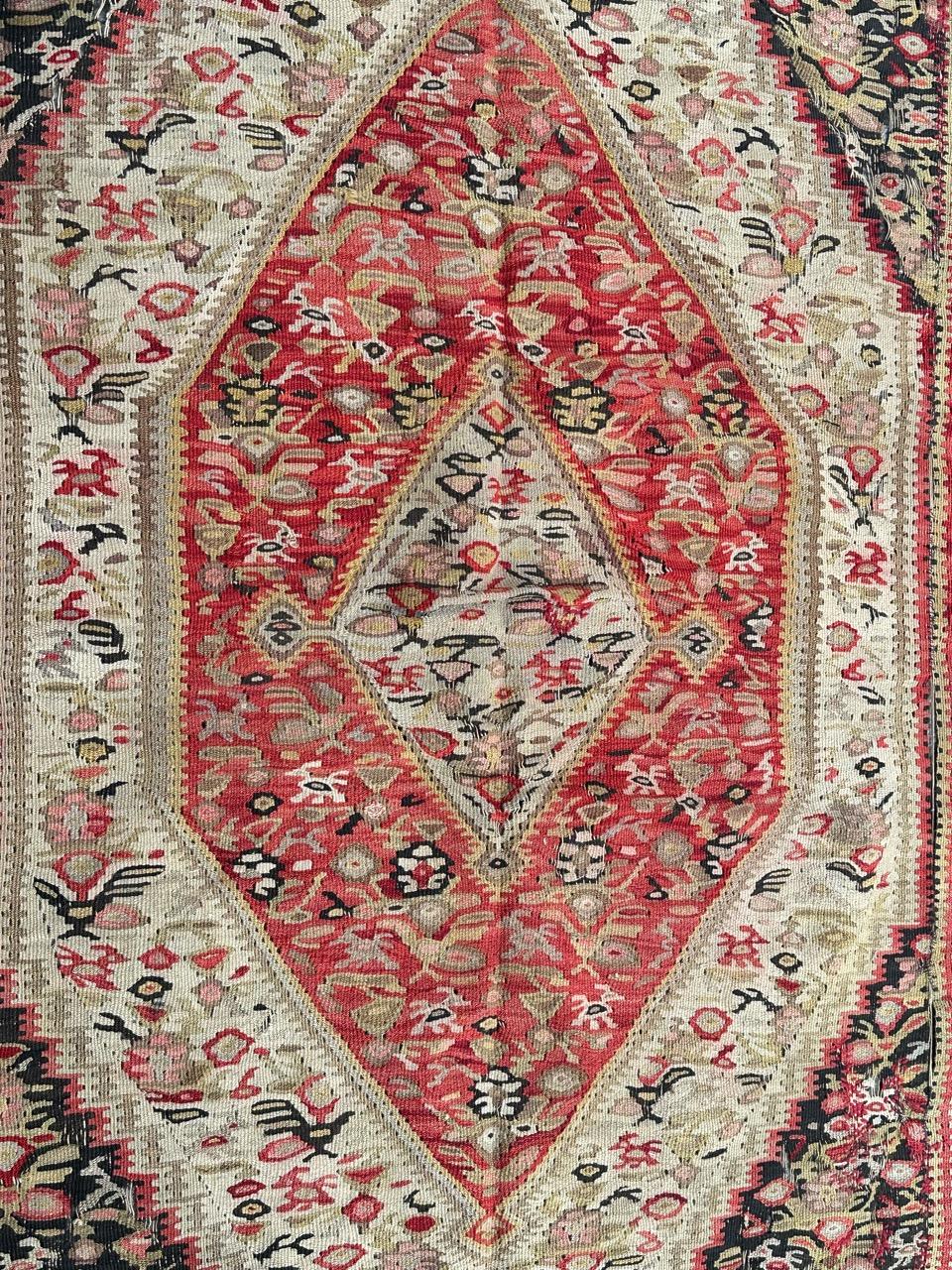 Very pretty late 19th century fine seneh Kilim with beautiful stylized and geometrical designs and nice natural colours with orange red, green, yellow, beige, purple and dark brown, entirely and very finely hand woven with wool on cotton