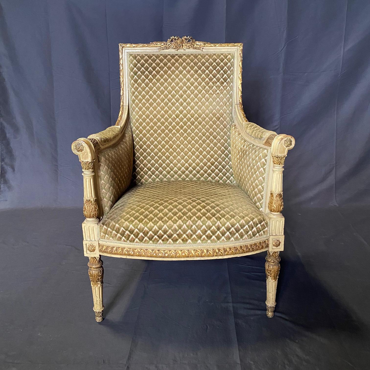 A very fine French 19th century Louis XVI style hand cream painted and carved pair of two bergeres or armchairs in original diamond cut fabric in very good condition as well as of high quality! The finely carved frames, padded arm supports and