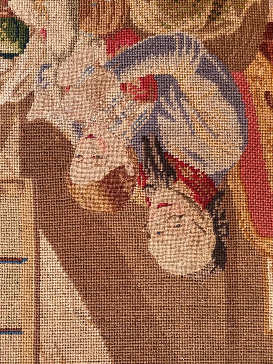 Very beautiful late 19th century needlepoint tapestry with beautiful design of a scene of an elderly lady teaching a young girl to sew, and with beautiful natural colors, entirely and finely hand embroidered with needlepoint method with wool and
