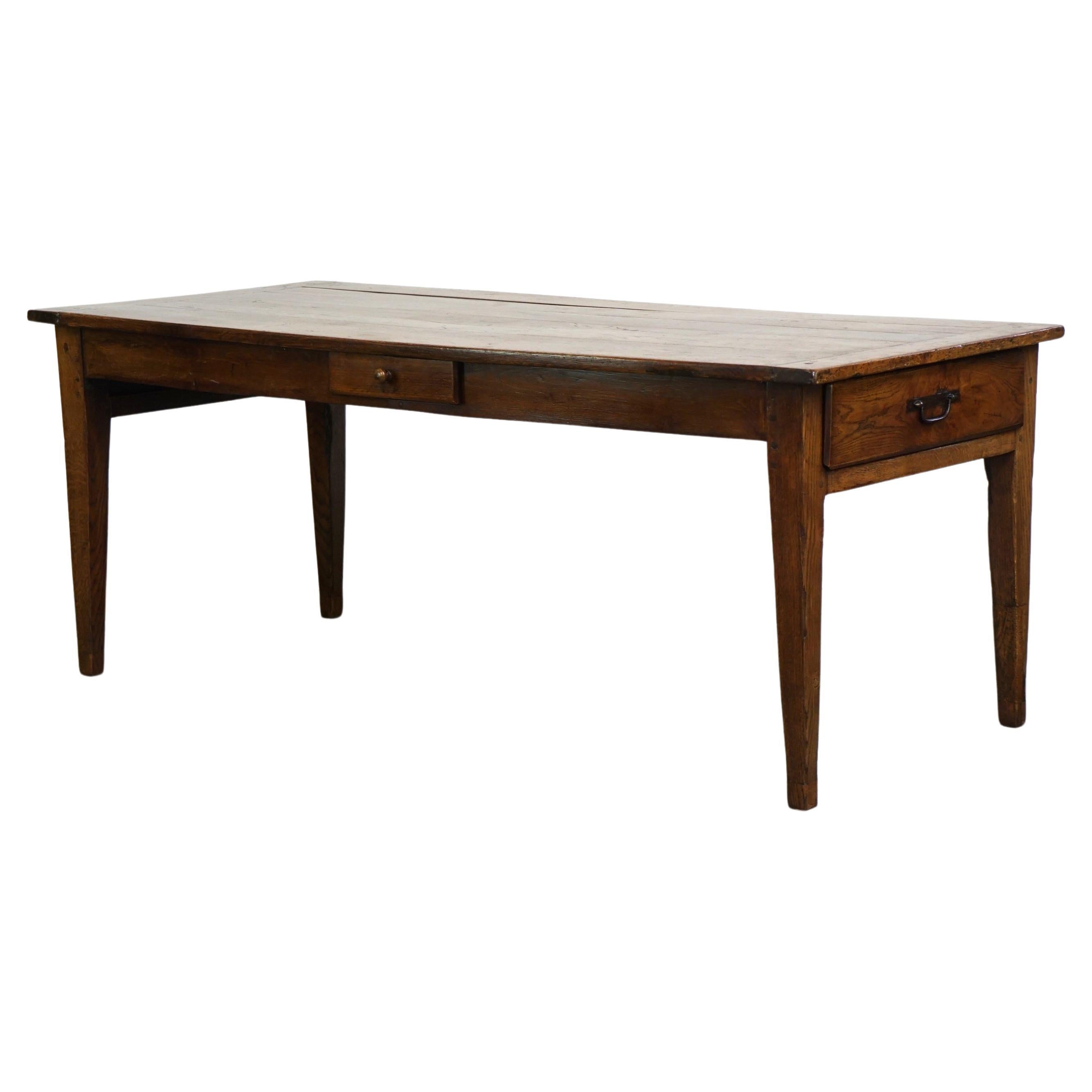 Beautiful antique French oak dining table with 3 drawers and an exquisite patina