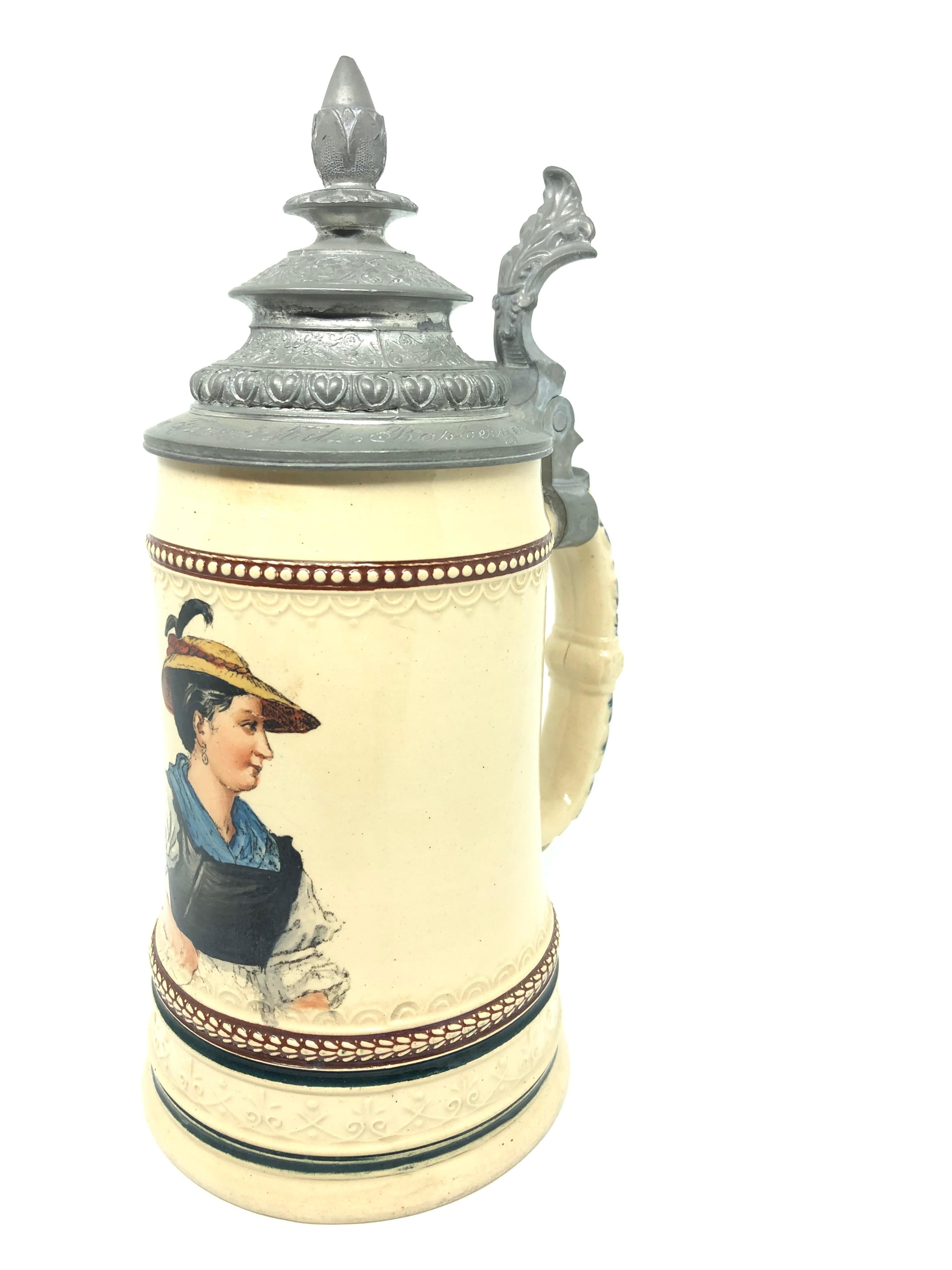 A gorgeous beer stein, hand painted picture of a Bavarian Female. This character beer stein has been made in Germany circa 1900s by Graf. Absolutely gorgeous piece hand painted and still in great condition, without damage. Lid works properly. Marked