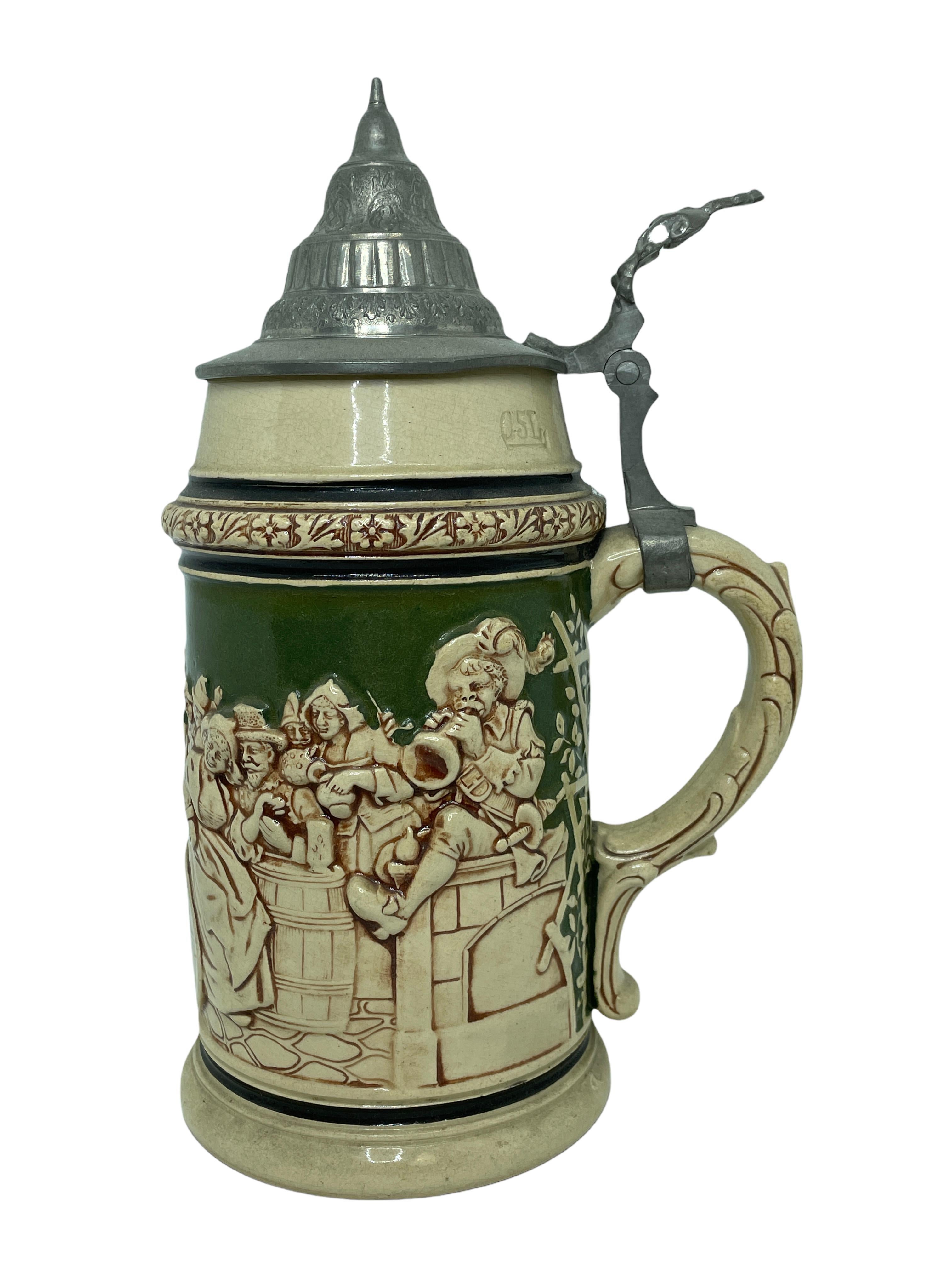 A gorgeous beer stein, made in Germany. This beer stein has been made in Germany, circa 1900s. Absolutely gorgeous piece still in great condition, without damage. Lid works properly. It is a 1/2 Liter Stein.