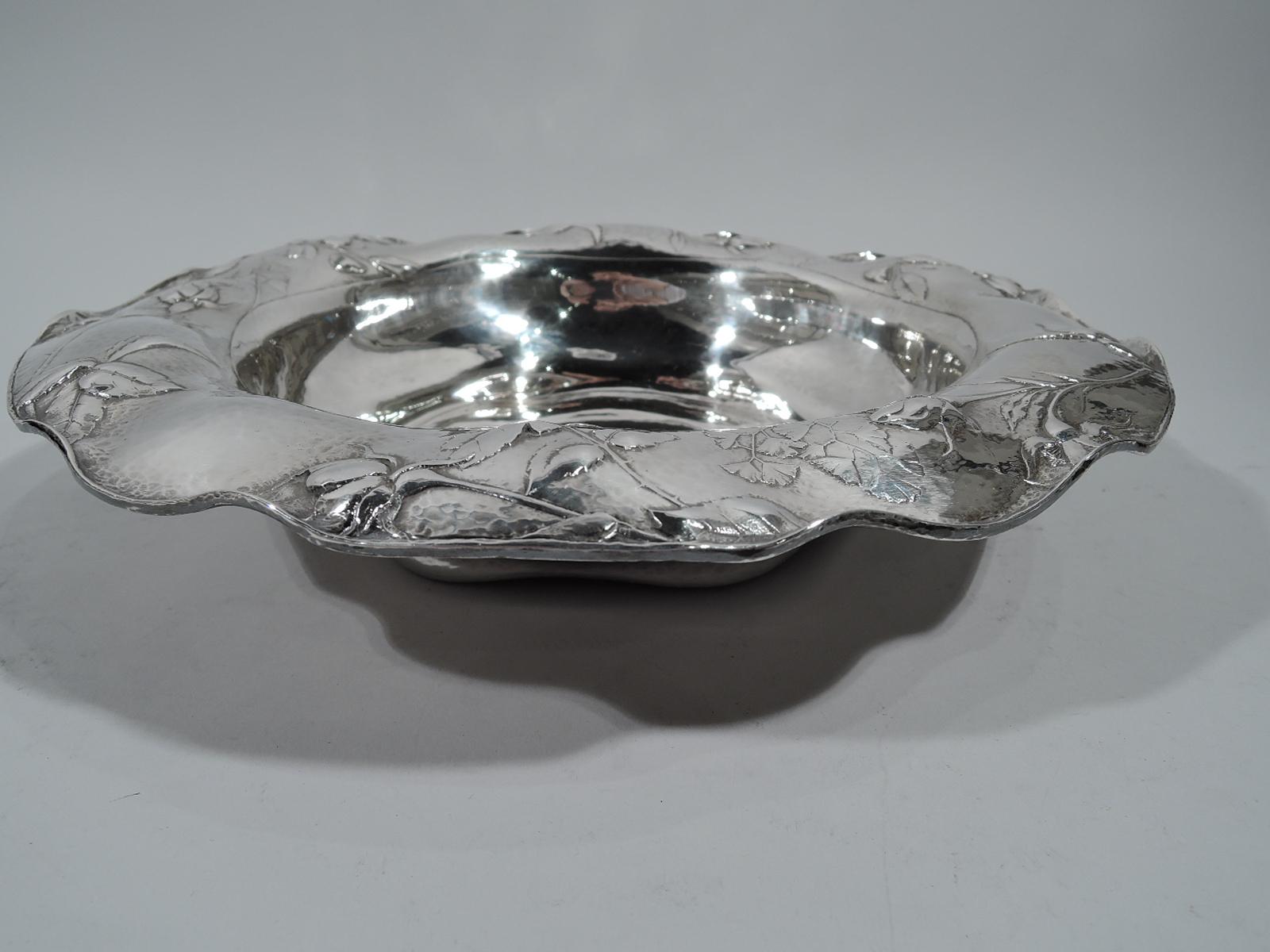 Beautiful Martele silver bowl. Made by Gorham in Providence on Mar. 26, 1914. Round well with shaped base and wavy and scrolled rim. Chased and restrained floral ornament in form of strewn roses. First-rate craftsmanship and fine honeycomb hand
