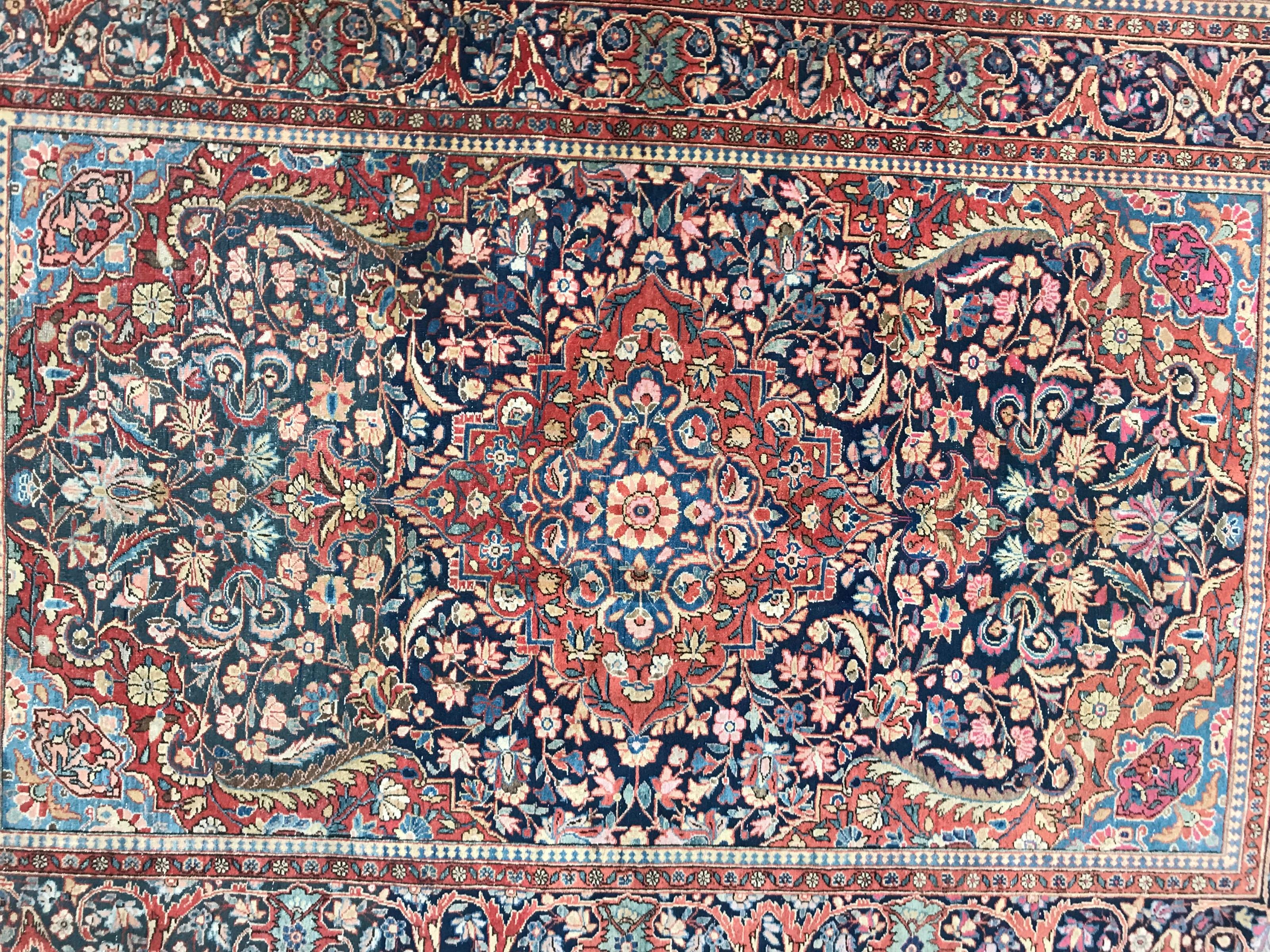 Nice early 20th century rug with beautiful Floral design with a central medallion, and beautiful natural colors with blue, red, orange, pink, yellow and green, finely hand knotted with wool velvet on cotton foundation.