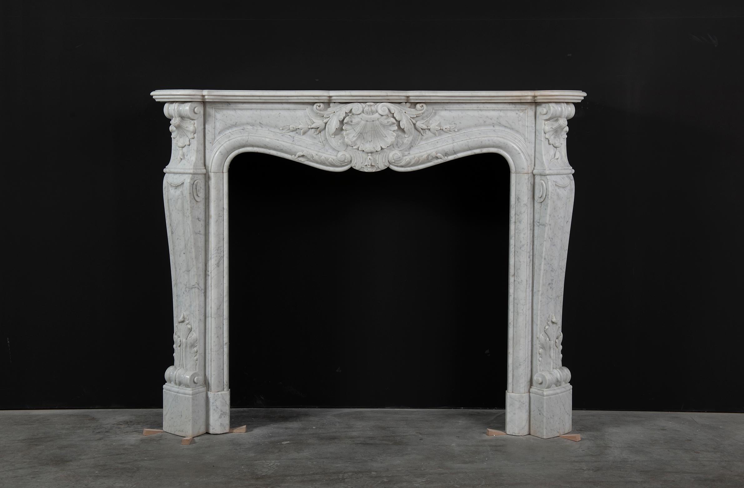 Beautiful antique Louis XV fireplace mantel

Very fine carved 19th century Louis XV mantelpiece from Paris.
Beautiful decorative piece.

The inner dimensions of this beautiful mantel are:
Highest height: 103 cm or 40.55 inch
Lowest height (middle)