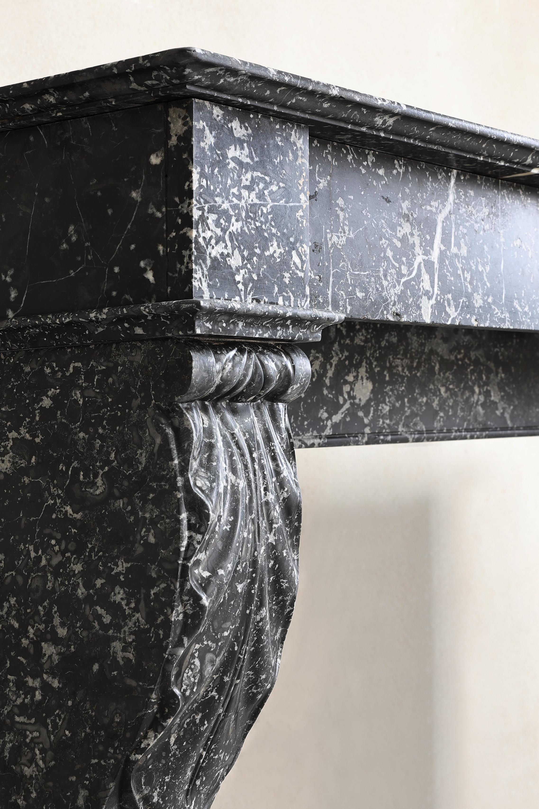 Beautiful antique mantelpiece made of black marble with white veins in the style For Sale 5