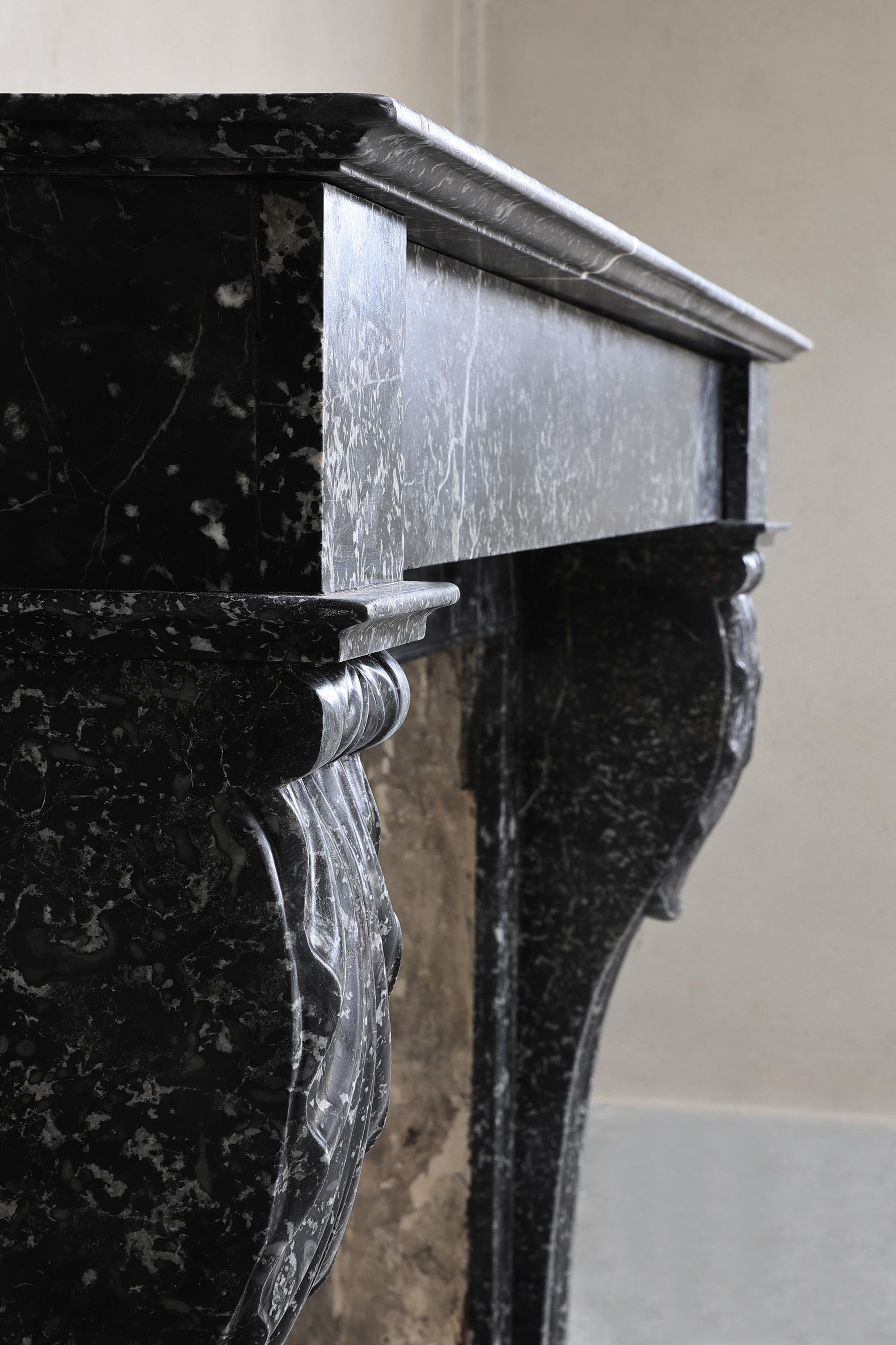 Beautiful antique mantelpiece made of black marble with white veins in the style For Sale 6