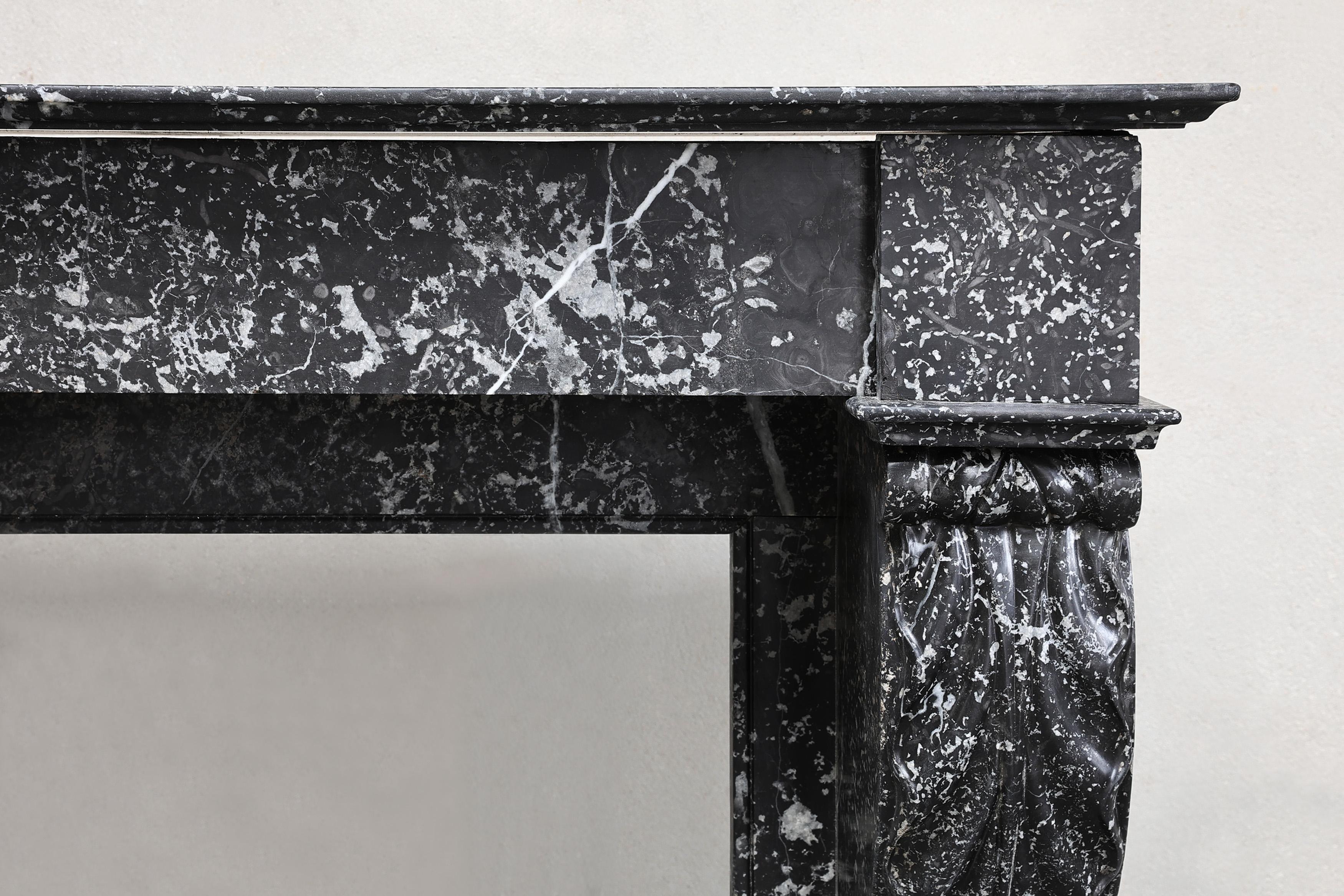 Other Beautiful antique mantelpiece made of black marble with white veins in the style For Sale
