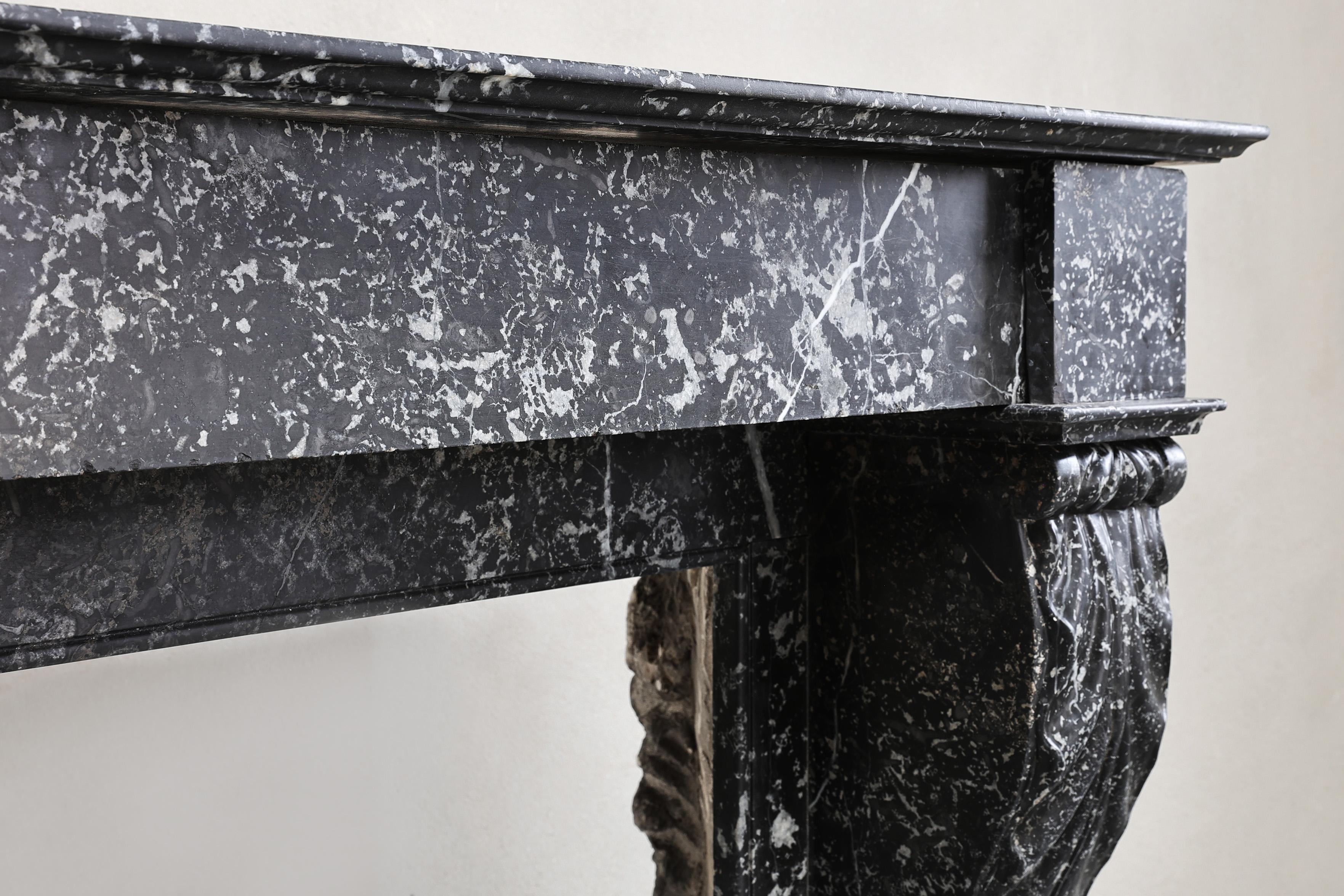 French Beautiful antique mantelpiece made of black marble with white veins in the style For Sale