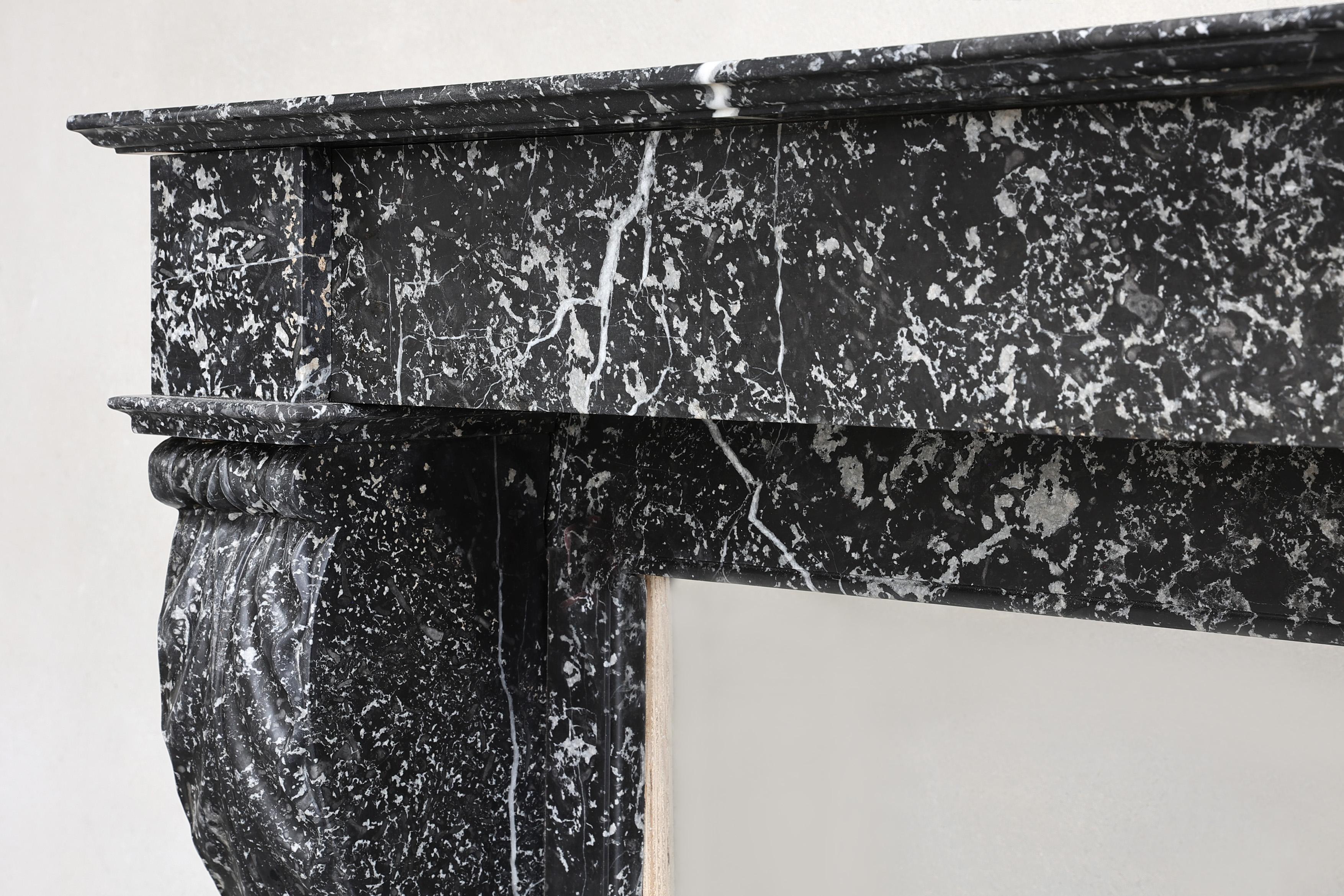 19th Century Beautiful antique mantelpiece made of black marble with white veins in the style For Sale