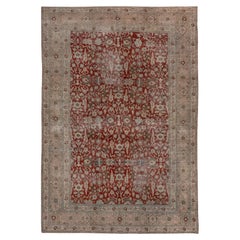 Magnifique tapis persan ancien de Tabriz, champ à fleurs rouge rubis, bordures douces