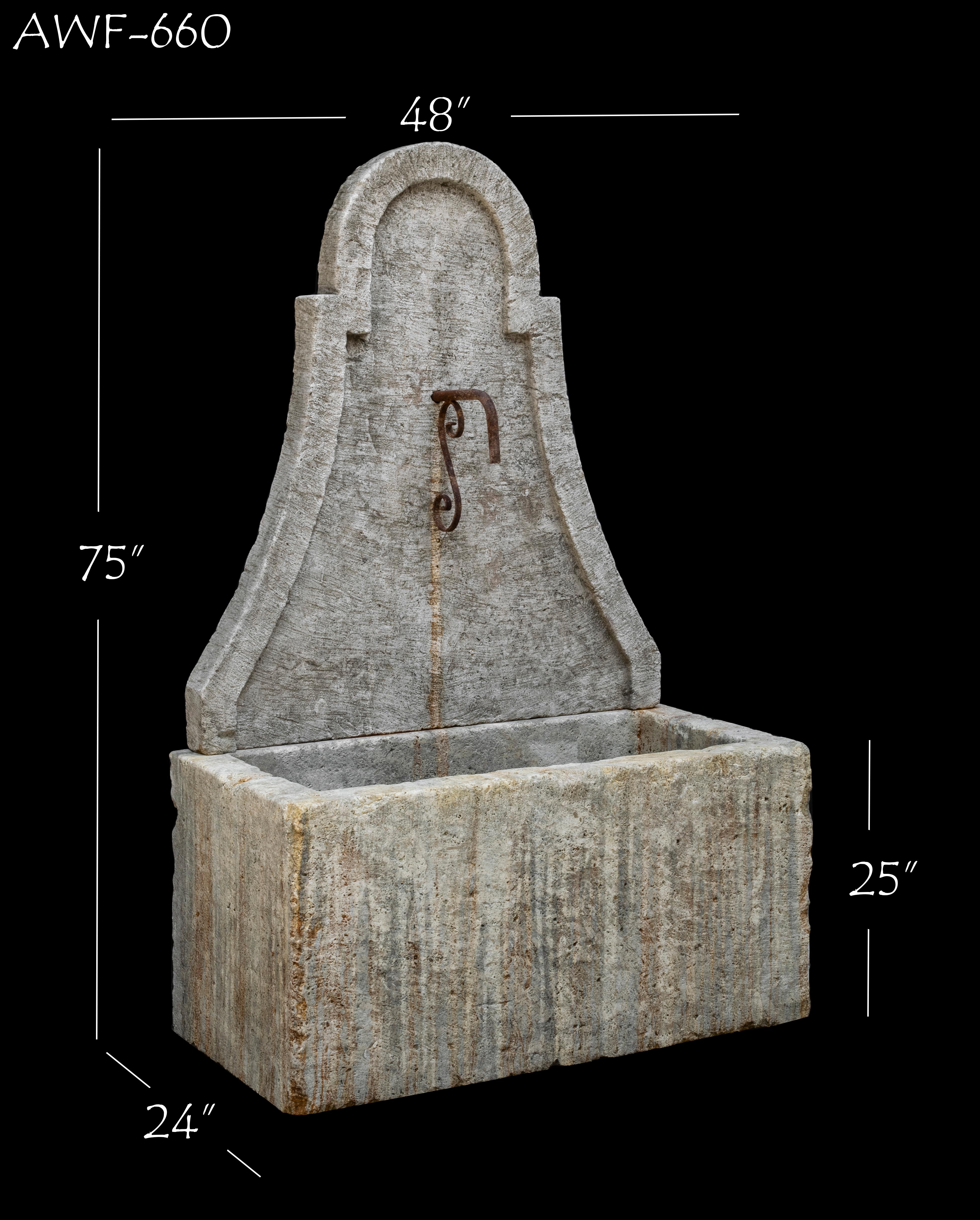 This beautiful antique 19th century limestone wall fountain is a great addition to any Mediterranean, Tuscan, rustic, or other custom style home. The naturally aged color and distressed patina for this old reclaimed hand-carved French fountain adds