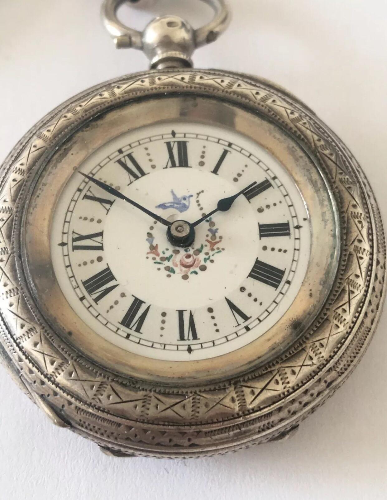 Antique Small Silver Pocket Watch With beautiful pocket watch chain.

This lovely enamel dial watch is in good working order and ticking well. 