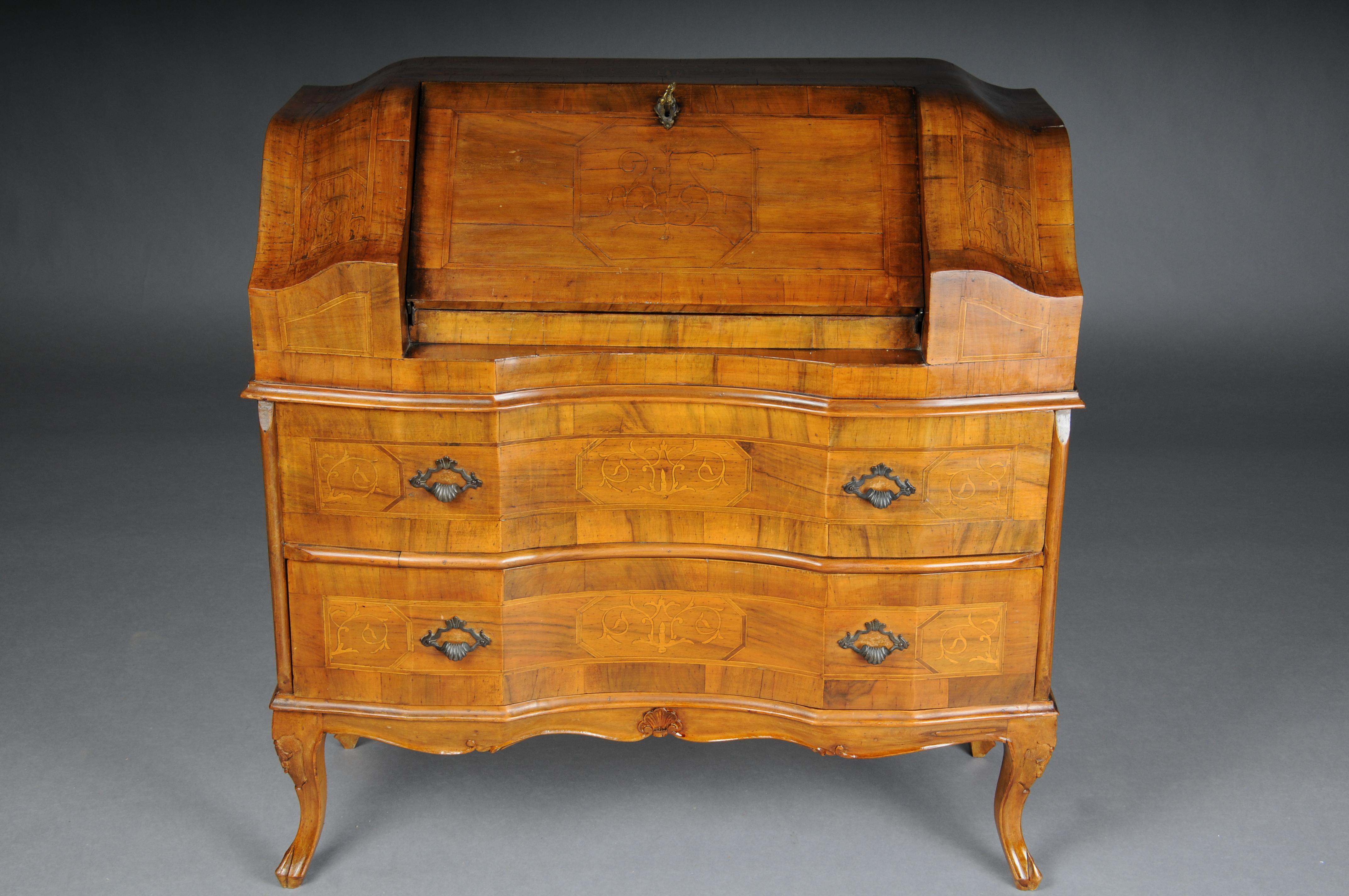 Beautiful antique slanted flap secretary, 20th century. Walnut root veneer.

Solid wood with walnut root veneer and inlays. Slanted flap secretary made of solid wood, baroque. Multi-curved body standing on high curved legs. 2 two-drawer fronts with
