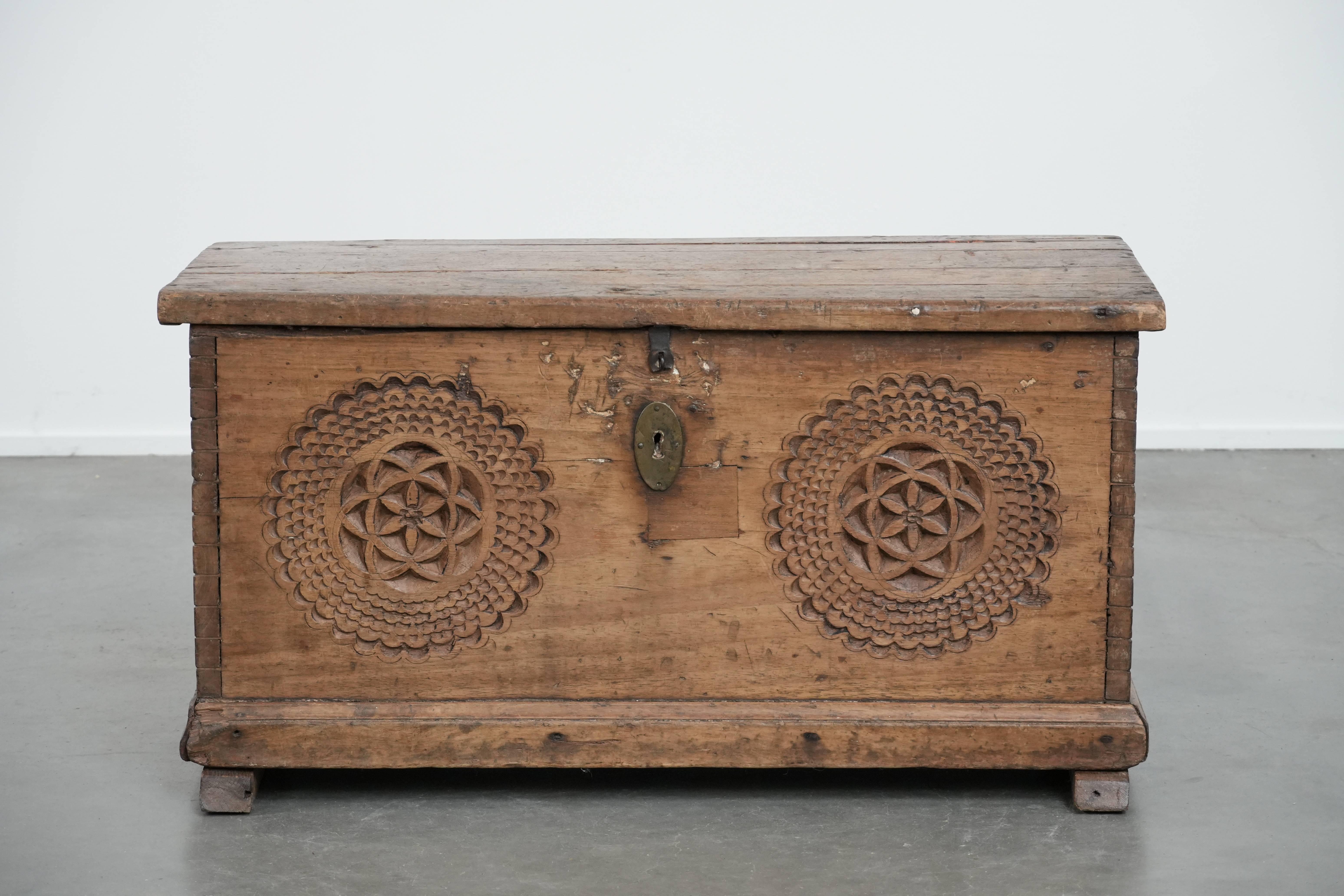 This beautiful antique Spanish chest, made of walnut, is a classic and characterful item. A perfect addition for antique lovers! It features beautiful wood carving and can be easily placed in almost any interior style. The chest has a warm, charming