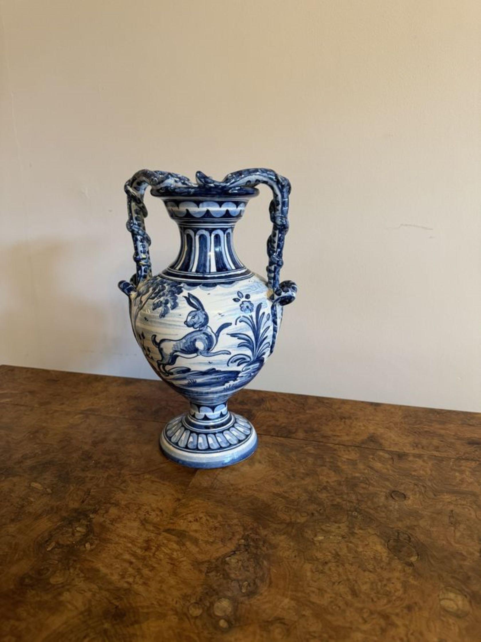 Beautiful antique Talavere blue and white vase having a beautiful antique blue and white vase with twin shaped handles to the sides with vine detailing, a fluted shaped neck above a bulbous shaped body, stunning decoration with a bird on one side