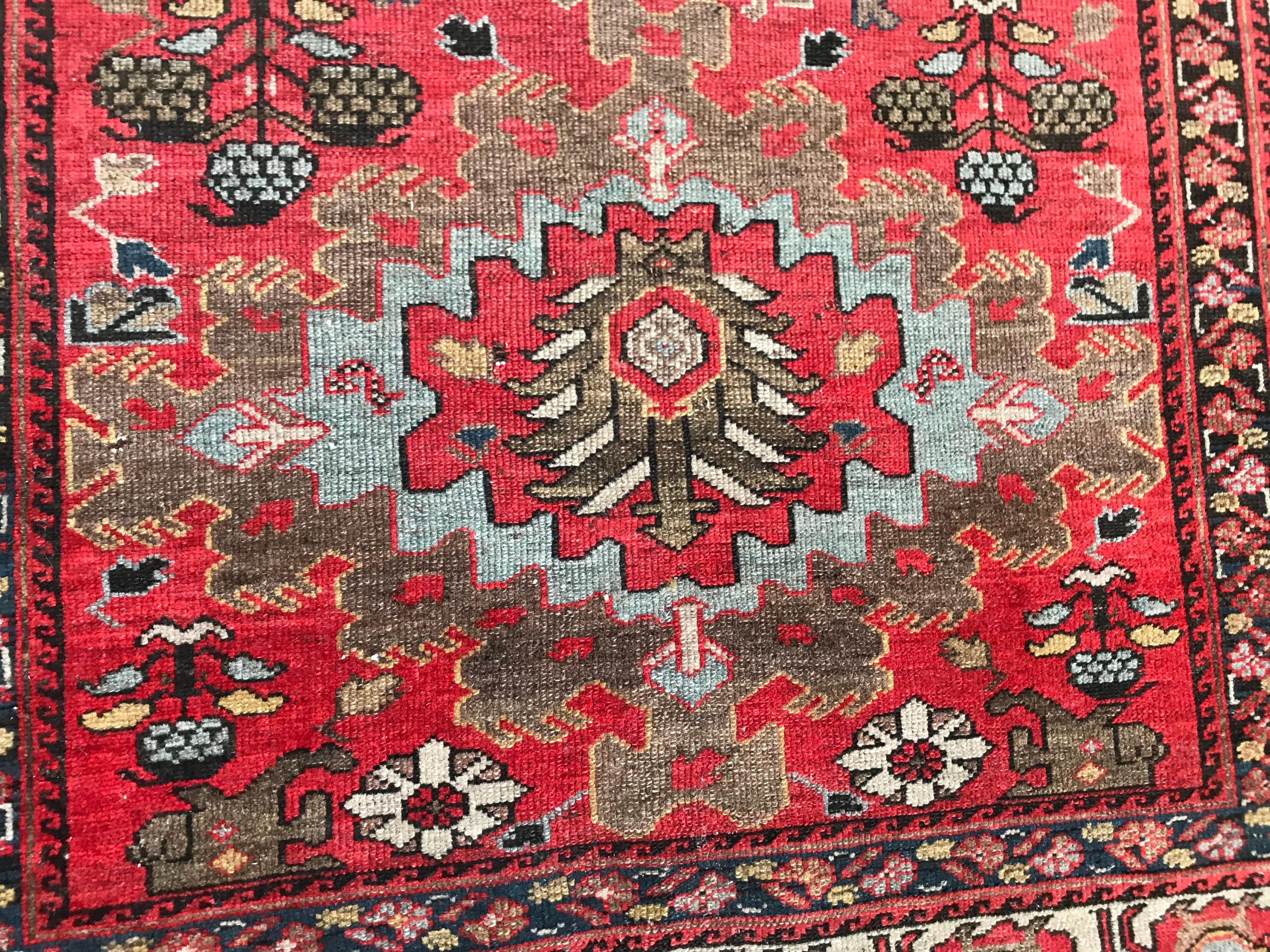 Beautiful late 19th century Tribal rug with nice design and natural colors, with red, blue, yellow and green, entirely hand knotted with wool velvet on cotton foundation.
