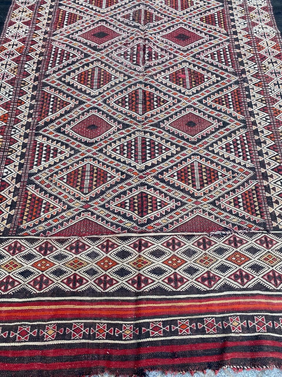 Nice antique Moroccan Kilim rug with geometrical tribal design and beautiful natural colors, entirely hand woven with wool on wool foundation.