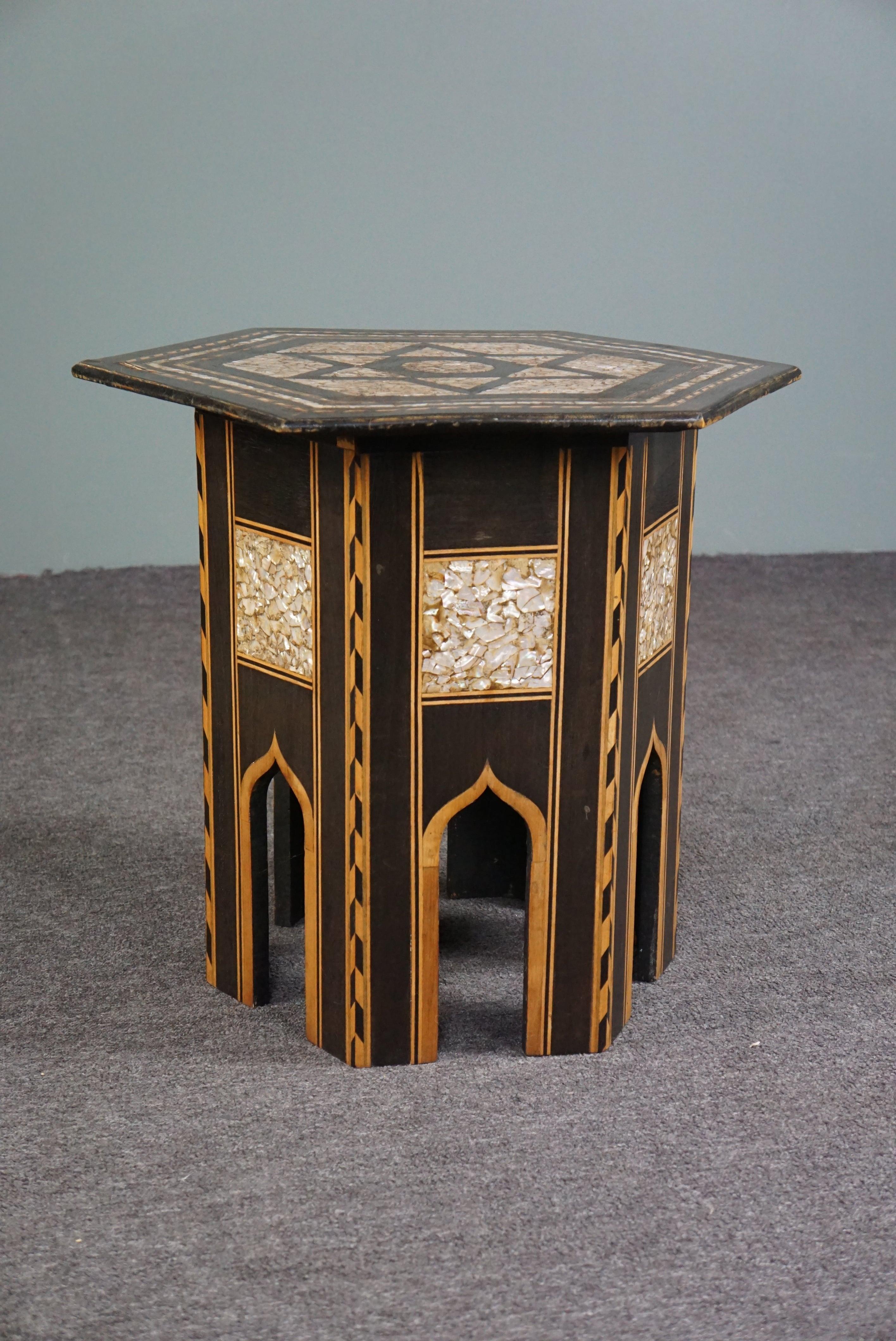 Offered is this beautiful richly decorated side table.

We are pleased to offer this beautiful, very richly inlaid side table for sale. This amazing piece of furniture is beautifully embellished with an intricate pattern and each piece of inlay is