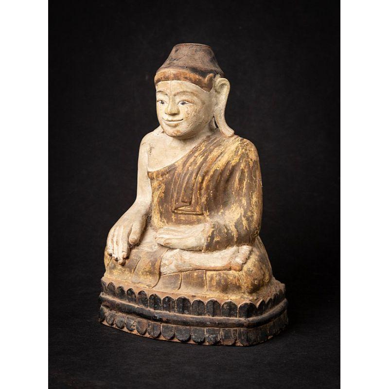 Material: wood
29,5 cm high 
20,8 cm wide and 17,2 cm deep
Weight: 1.791 kgs
With a very friendly face & unusual base
Mandalay style
Bhumisparsha mudra
Originating from Burma
19th century

