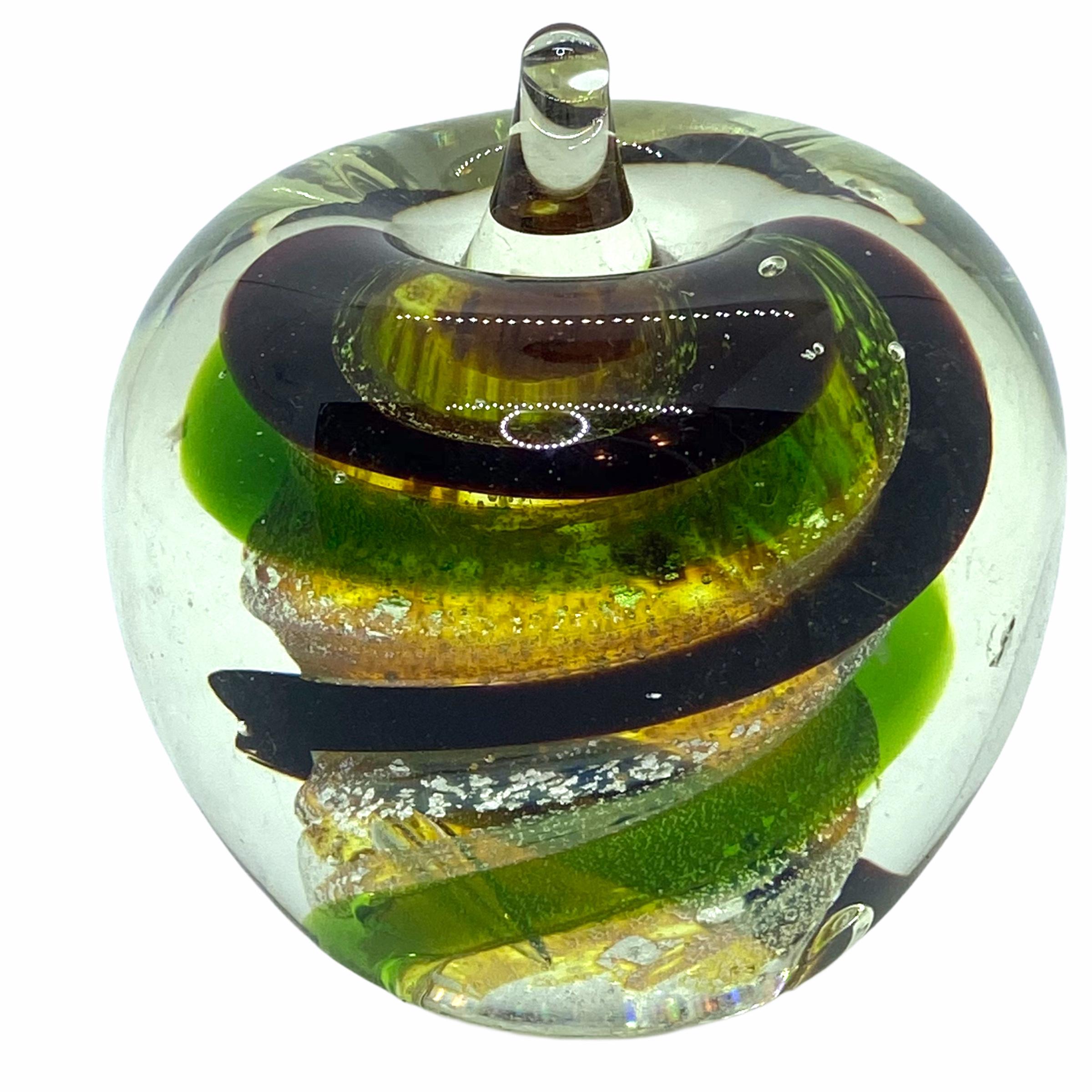 Beautiful Murano hand blown Italian art glass paper weight. In the shape of an apple, with colorful swirls inside. Colors are a green, silver, brown and clear. A beautiful nice addition to your desktop.
