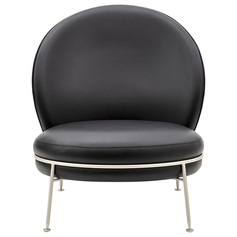 Magnifique fauteuil en cuir noir avec fermeture éclair visible, collection Amaretto Champagne