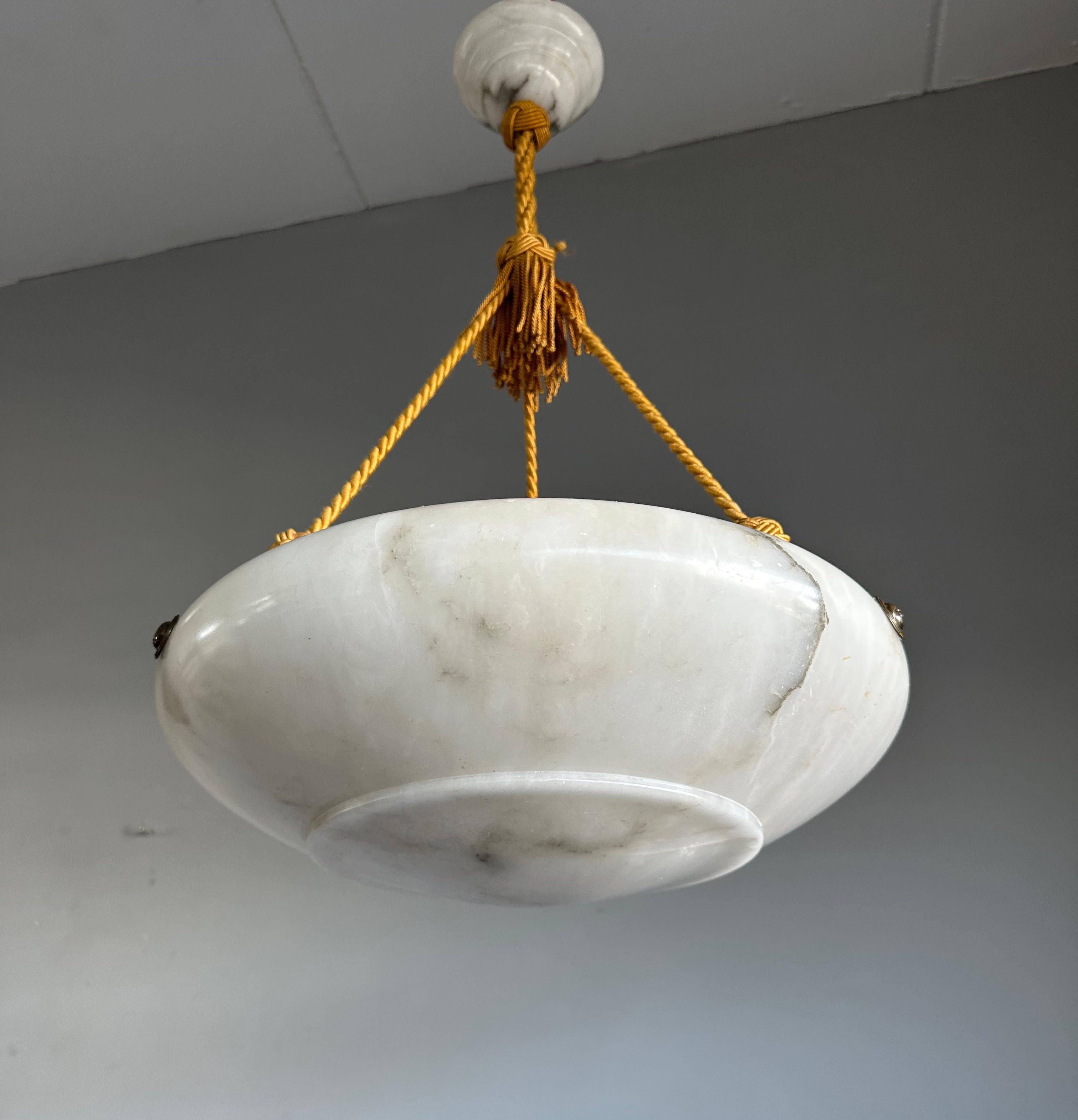 Top class design and superb quality, large white alabaster 3-light chandelier.

This early 20th century pendant light comes with a wonderful design and a superb condition, white alabaster shade with stunning veins. The mint and original matching
