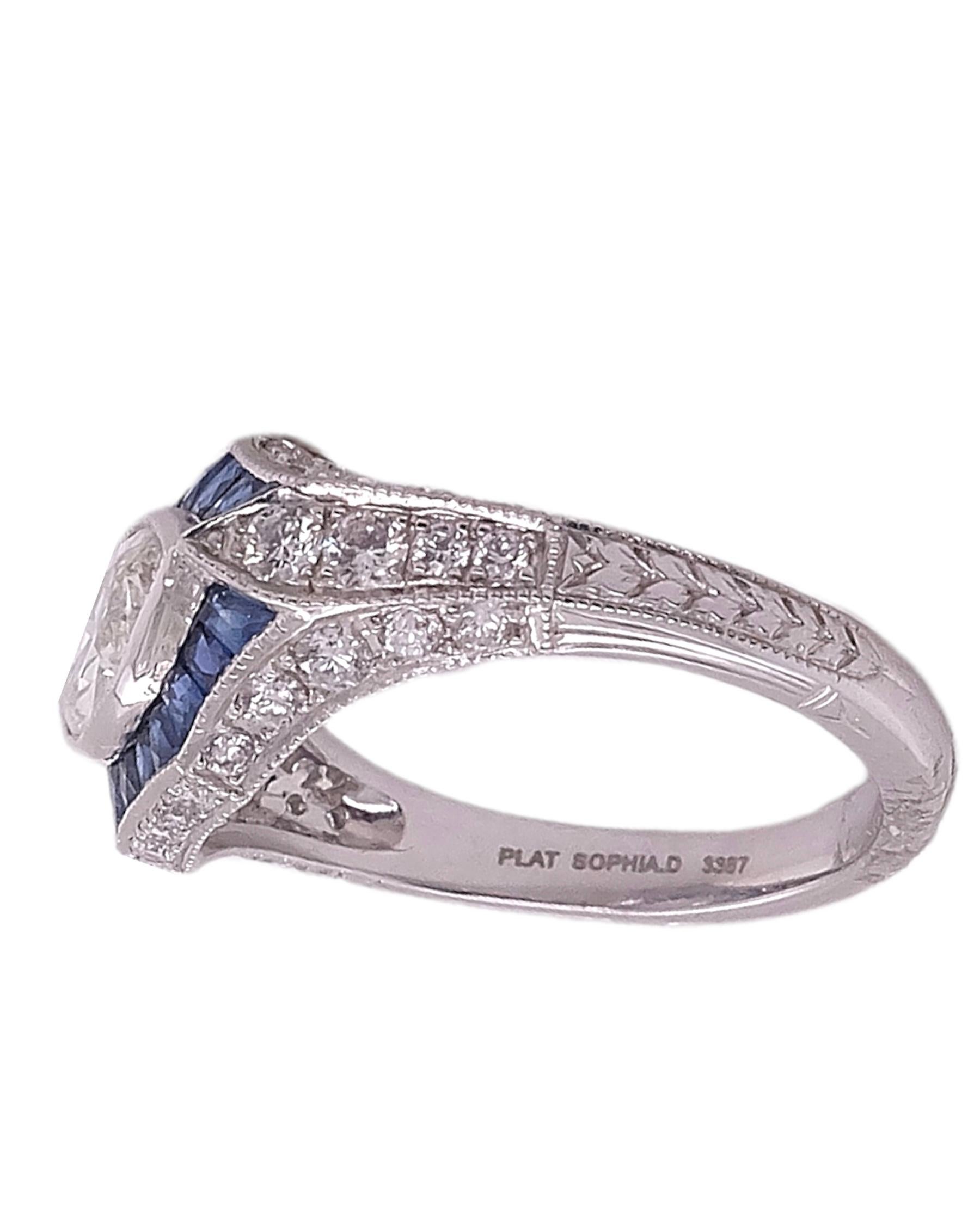 Beautifully designed Art Deco Ring by Sophia D that features 1.02 marquise cut center stone complemented with 0.56 Carat blue sapphires and 0.61 carat small round diamonds. The ring is set in platinum and a size 6 1/2. It is available for