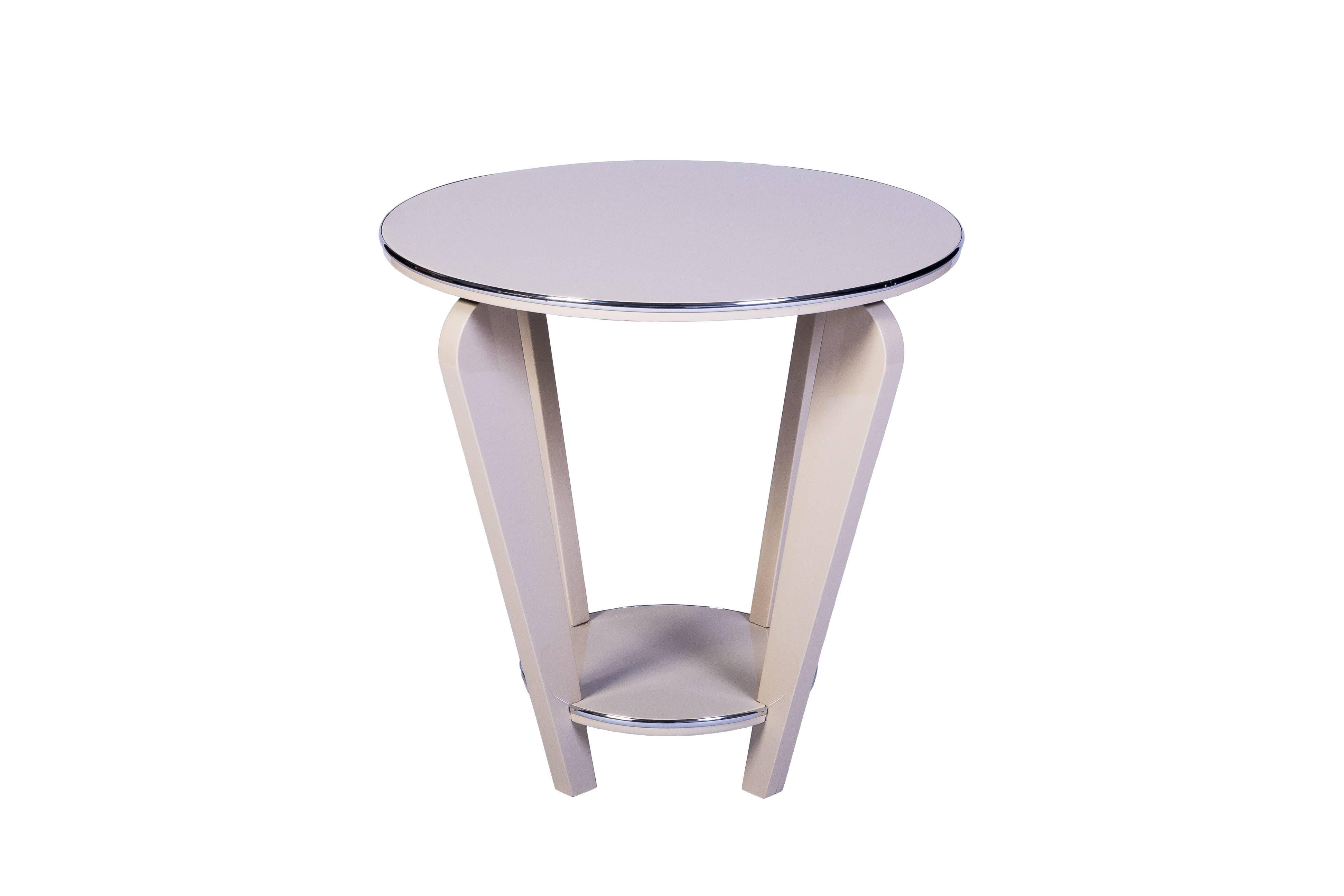 This beautiful Art Deco end or side table features a conical design with curved legs, chrome detailing and a beautiful high gloss white lacquer finish.