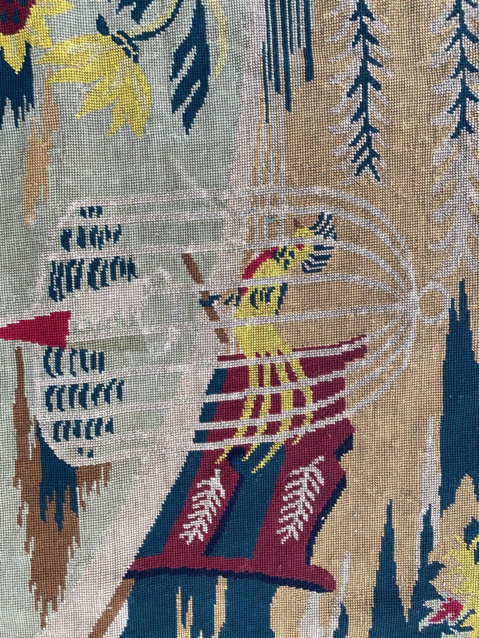 Nice midcentury tapestry with an Art Deco design and beautiful colors with green, red and yellow, entirely hand embroidered with needlepoint method with wool on cotton foundation.
