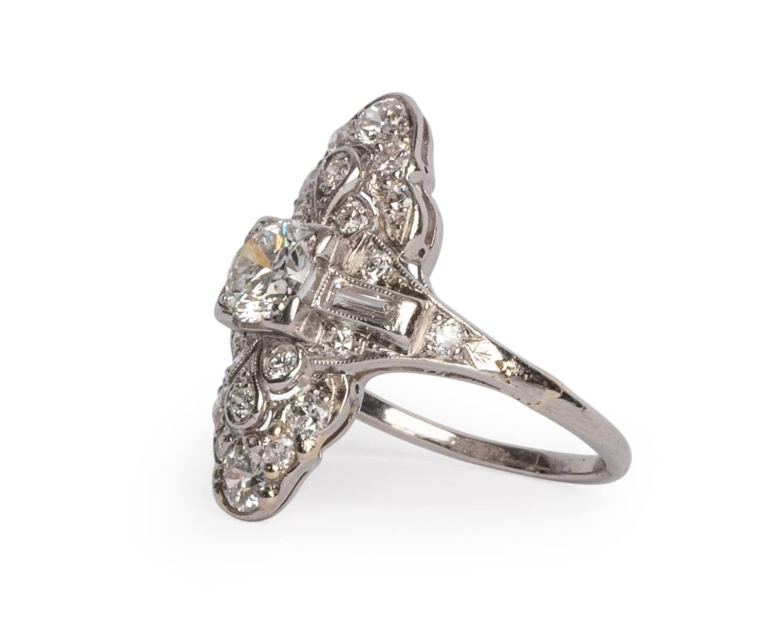 Here we have an 1930's  Art Deco Platinum aprox 1/2 cttw Old European Cut Diamond Shield Ring! The intricate filigree designs really tie together the look of this art deco stunner!  This piece is true to the Art Deco. The shape is truly unique and